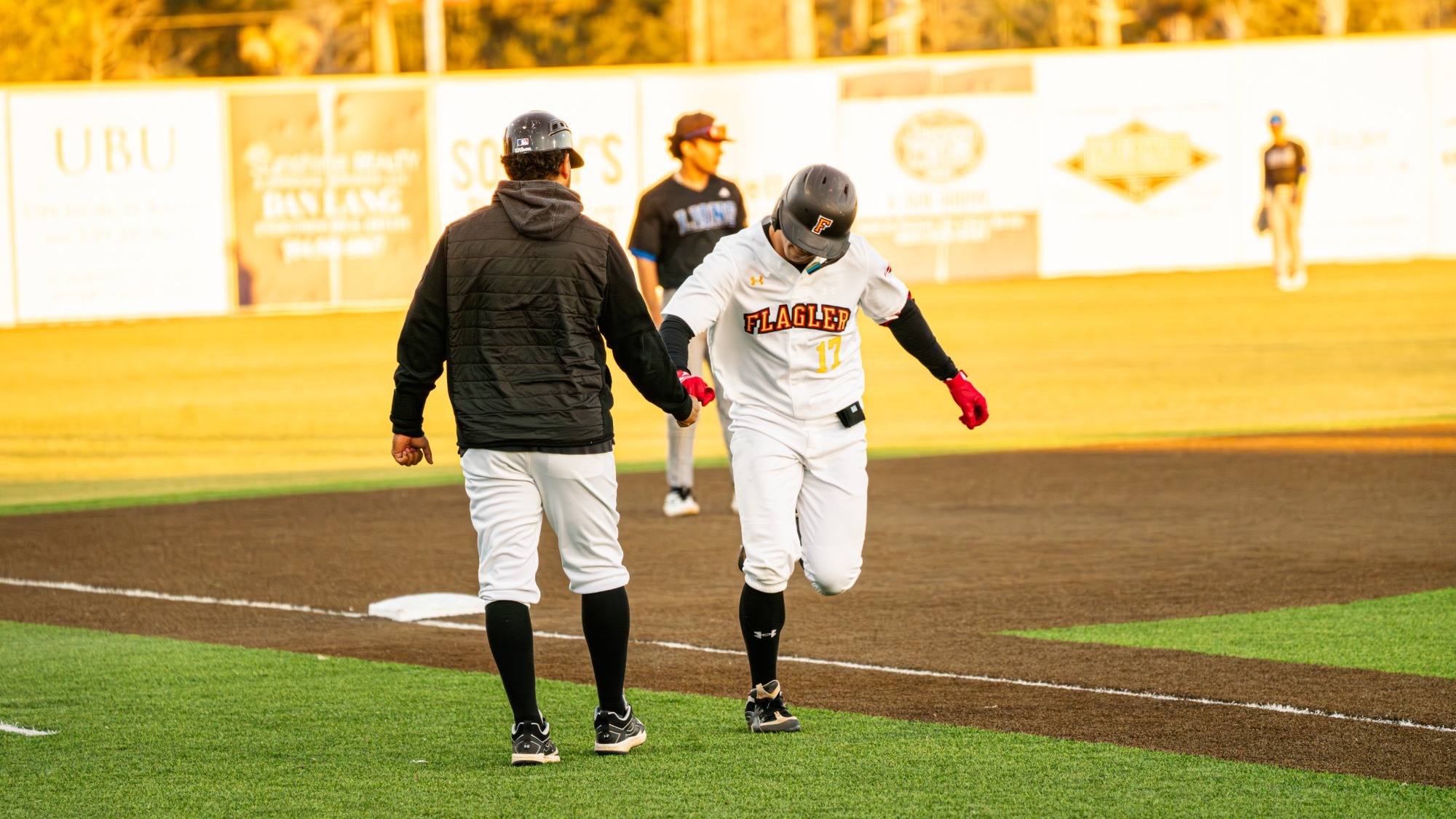 AJ Hunerberg rounds third base after hitting the first of his two home runs