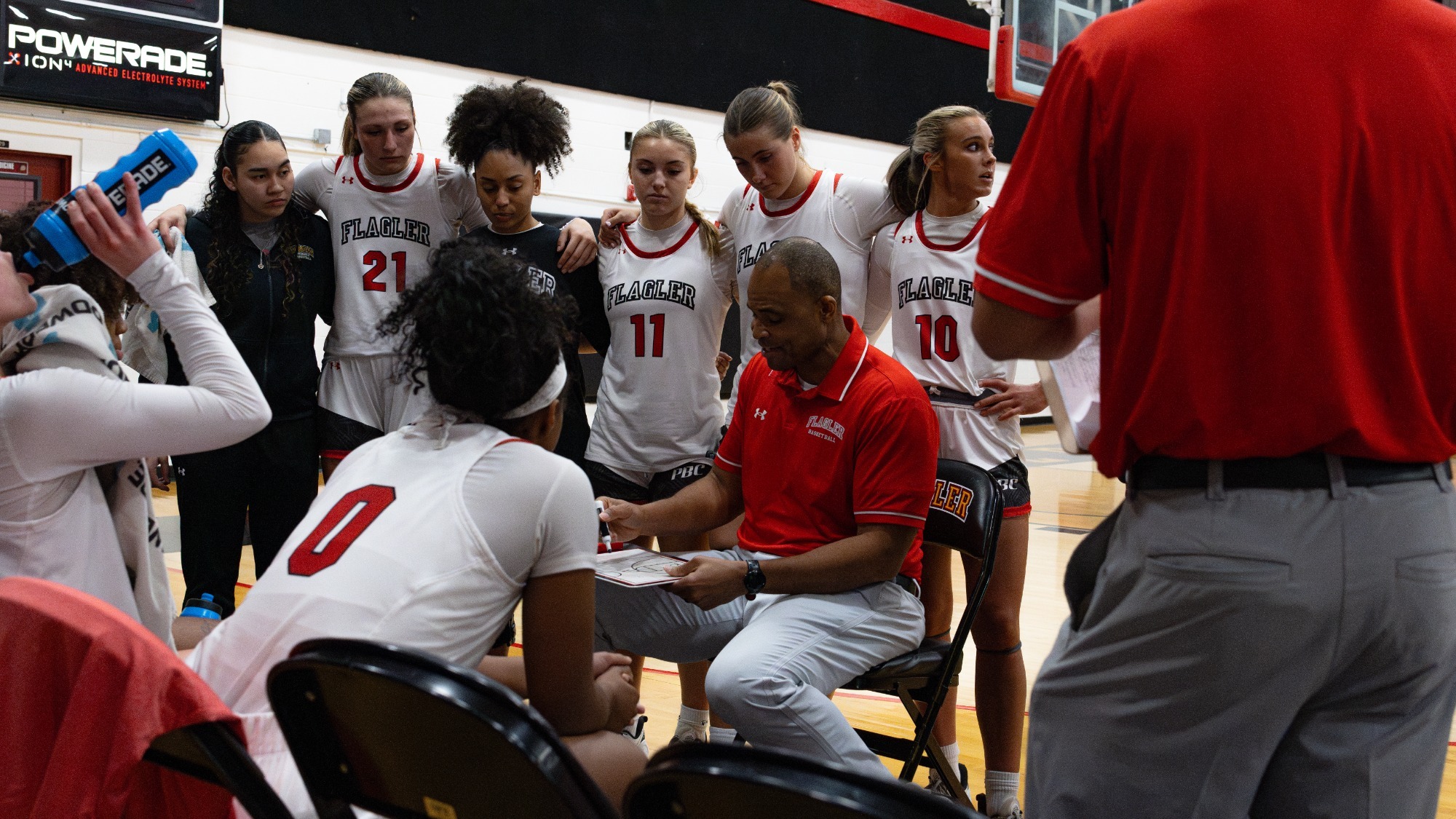 Coach Smith instructs the team at a timeout