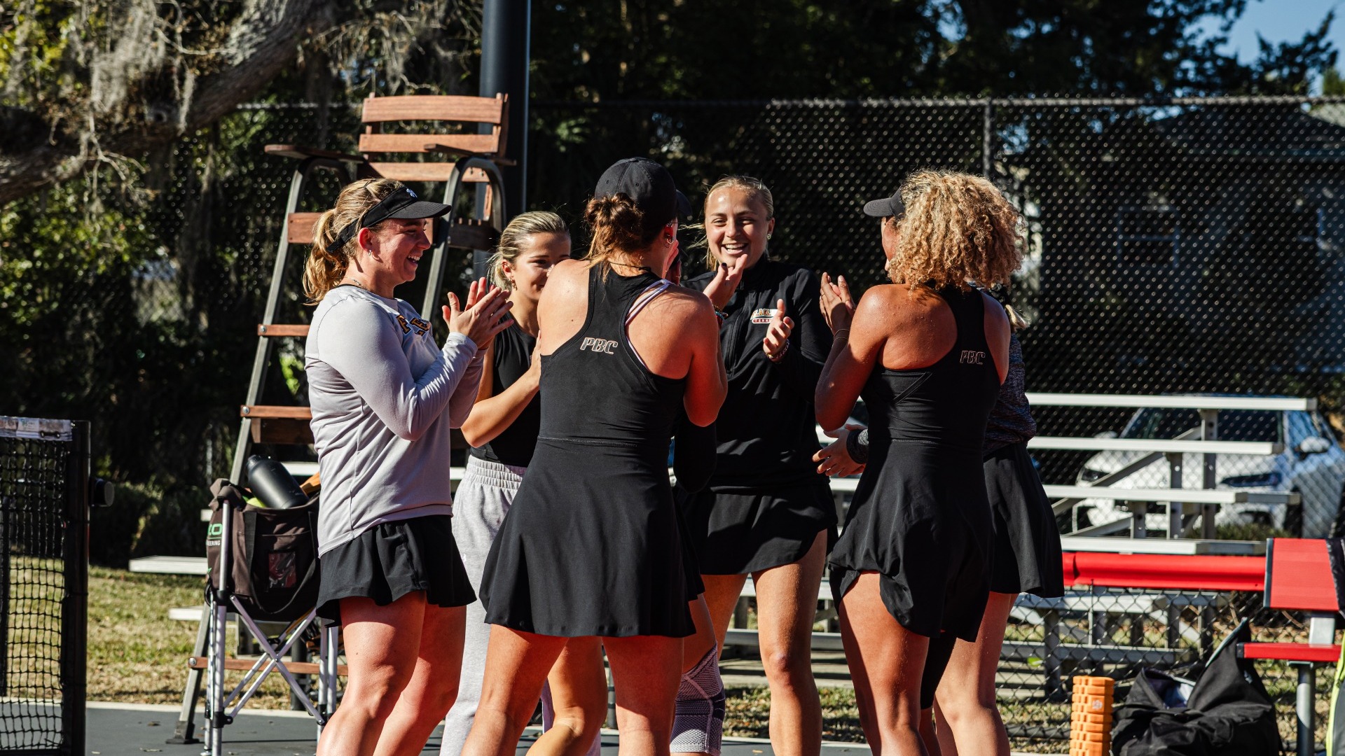 team smiling and high fiving