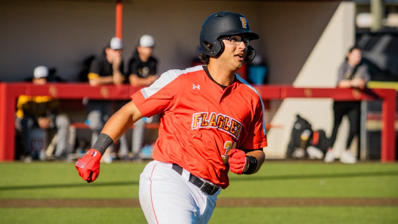 Eli Maddox running down the first base line