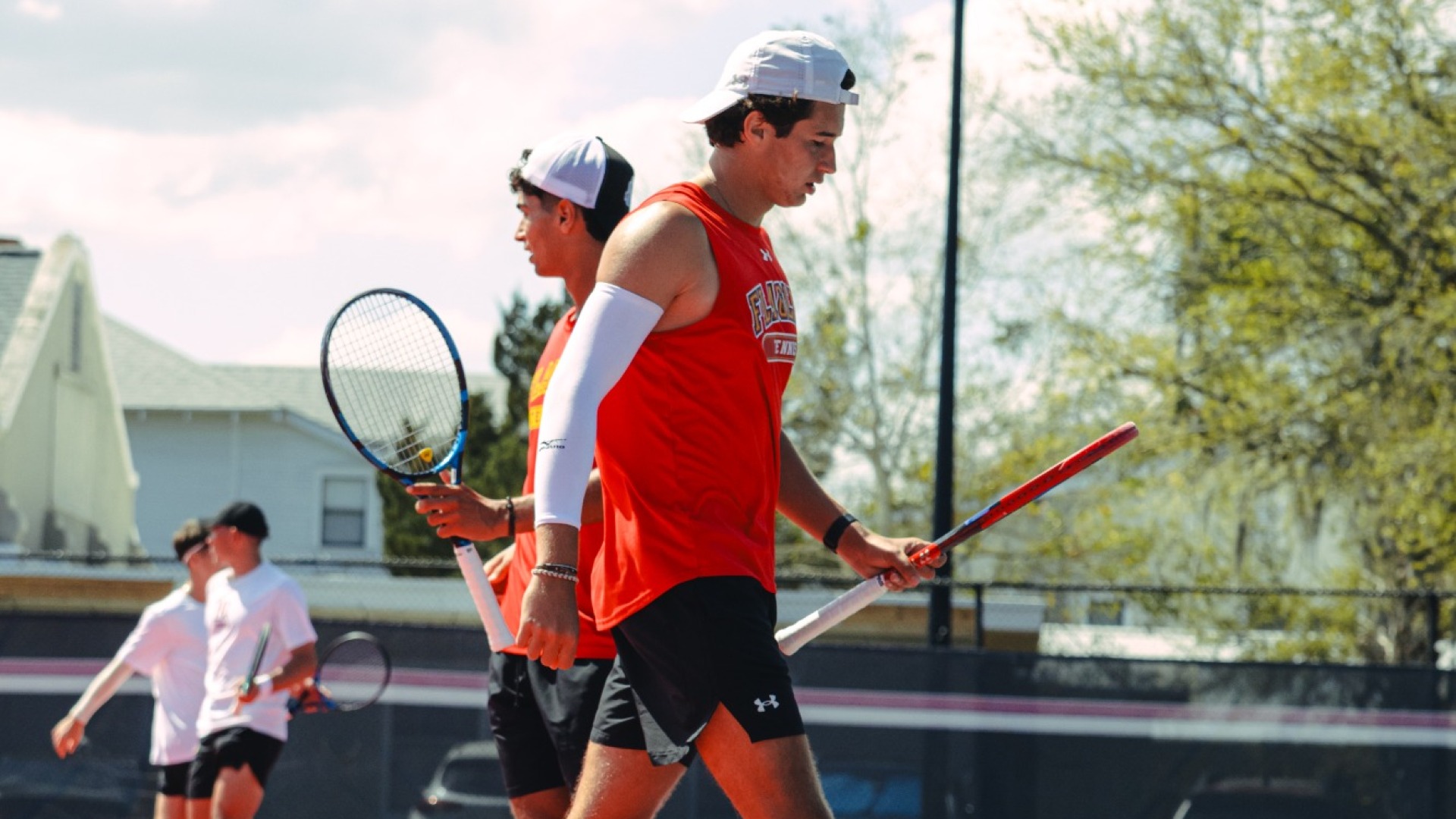 Aly El Rafie and Filip Kana walking past eachother