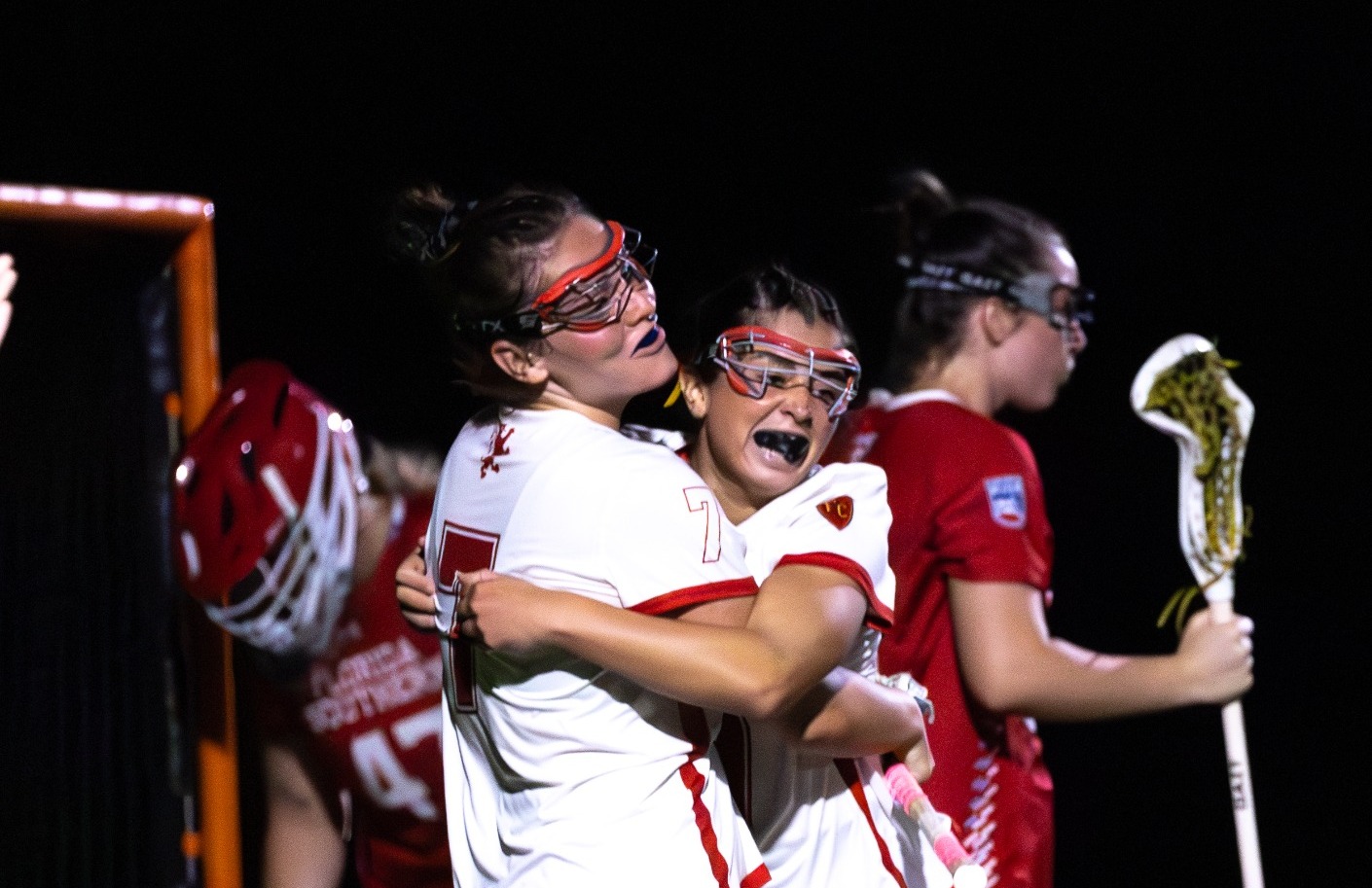Carley Tepel and Ava Lambros hugging after a goal