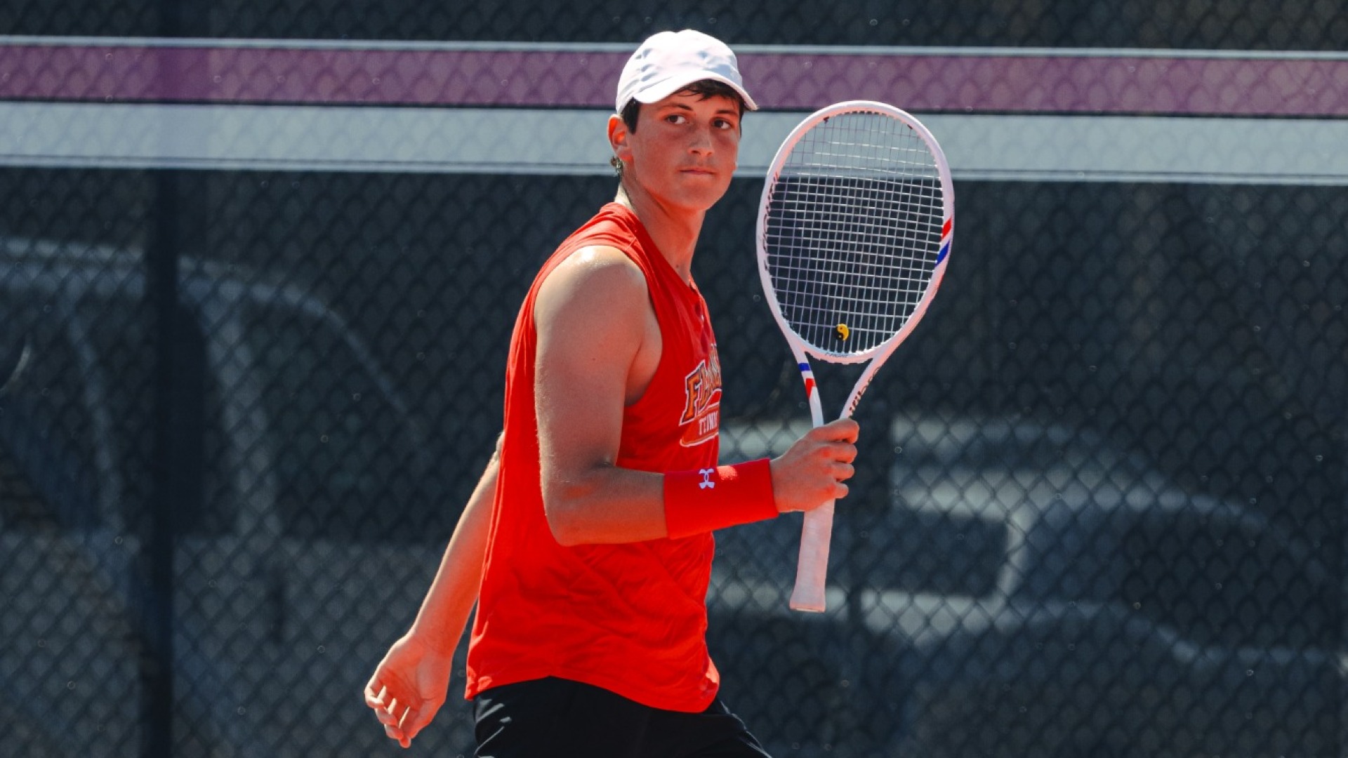 Noah Paterson lifting his racquet victoriously