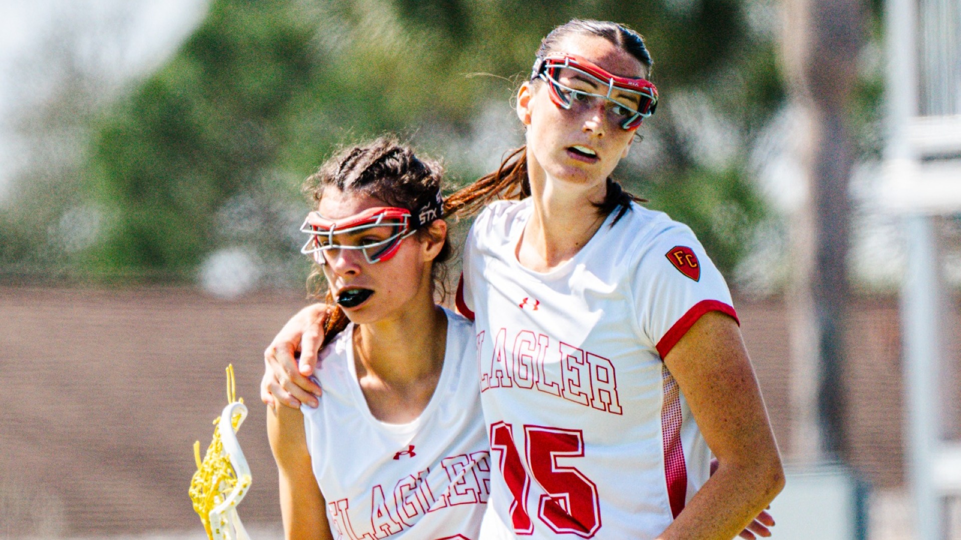 Ella Pinder and Carly Bagnasco side hugging