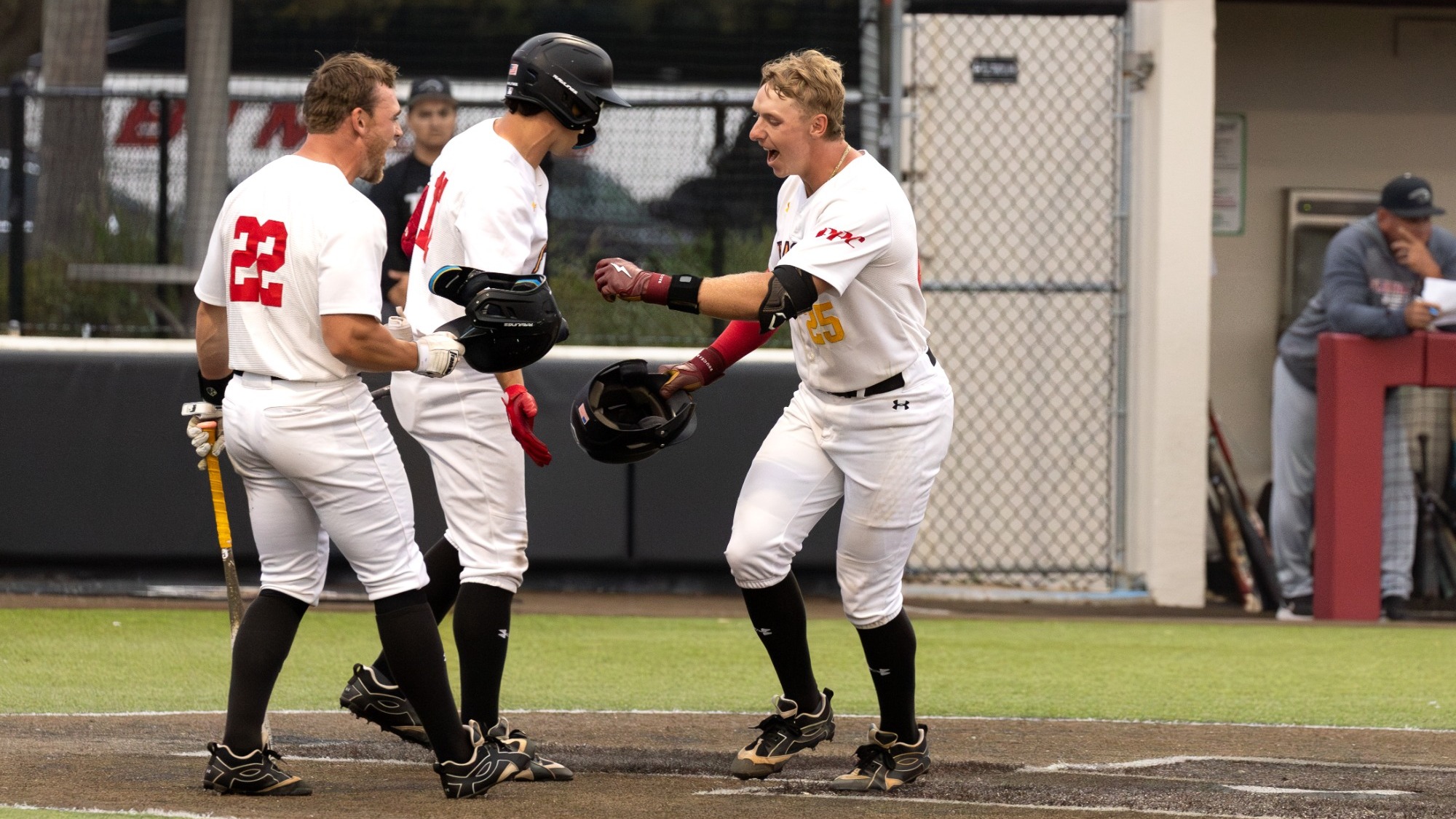 George Gilson celebrates at home plate with teammates