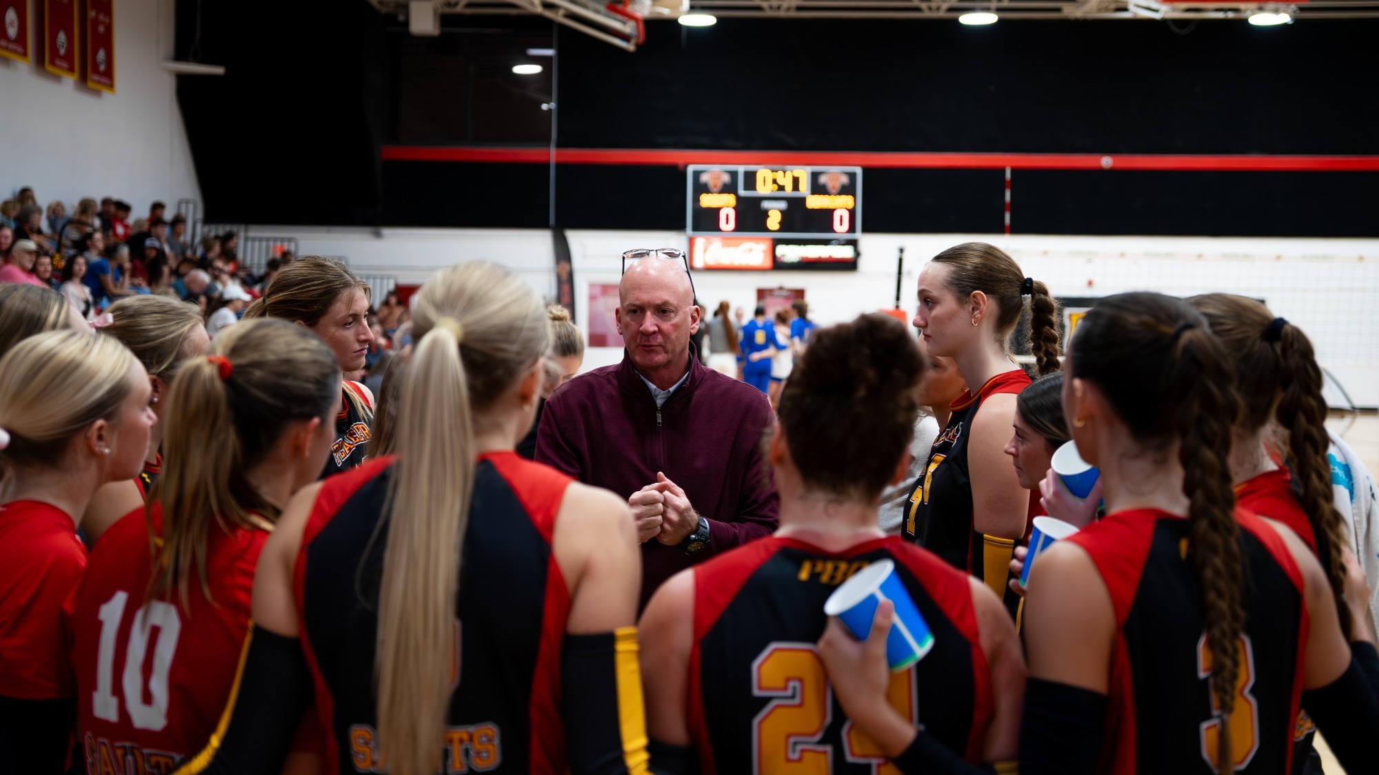 Coach Reynolds talks to the team during a timeout