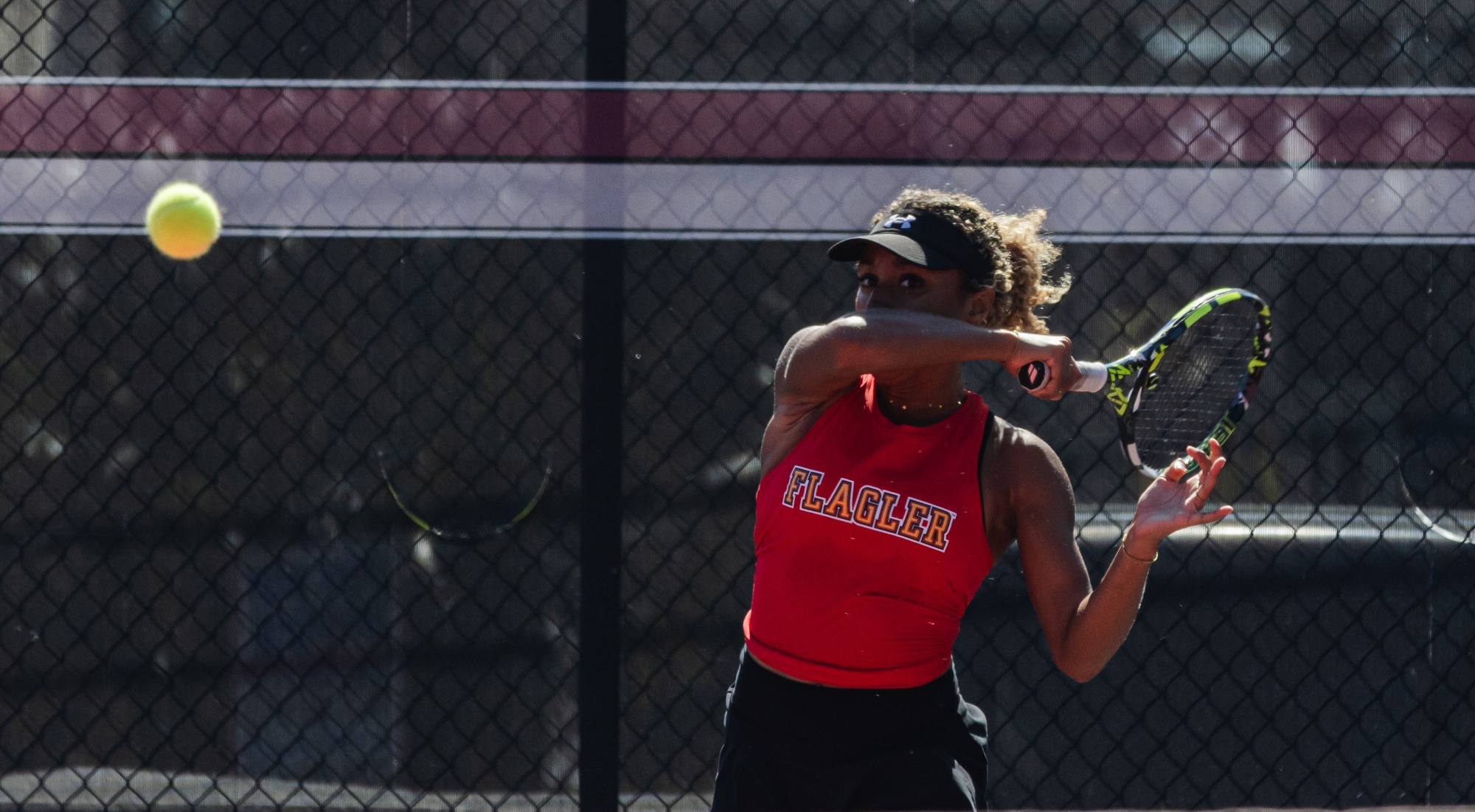 Front shot of Elena Ondobo forehand follow through
