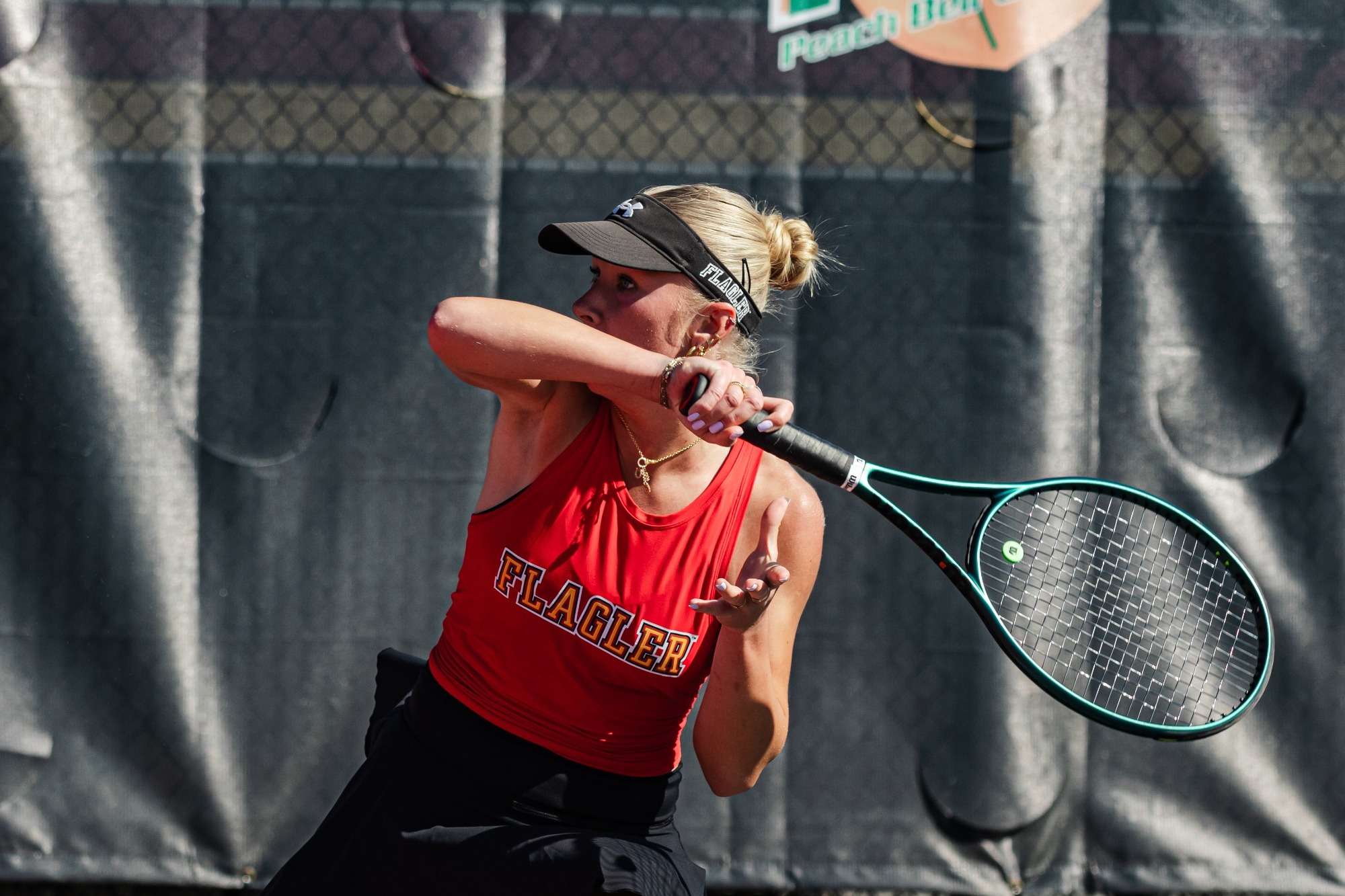 Eryka Kruk covering her face with her follow through