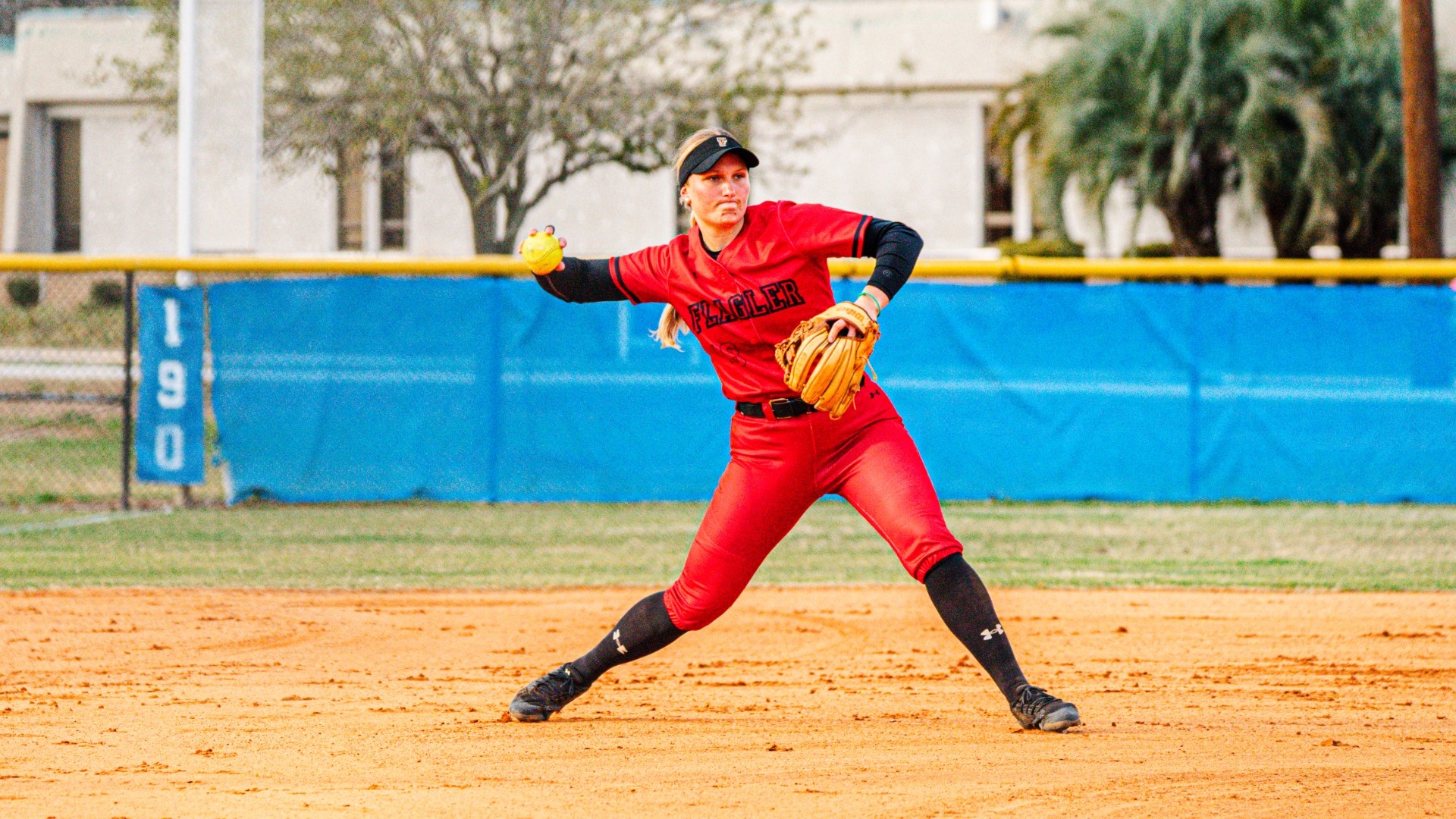 Kiley McQuillan about to throw the ball to first