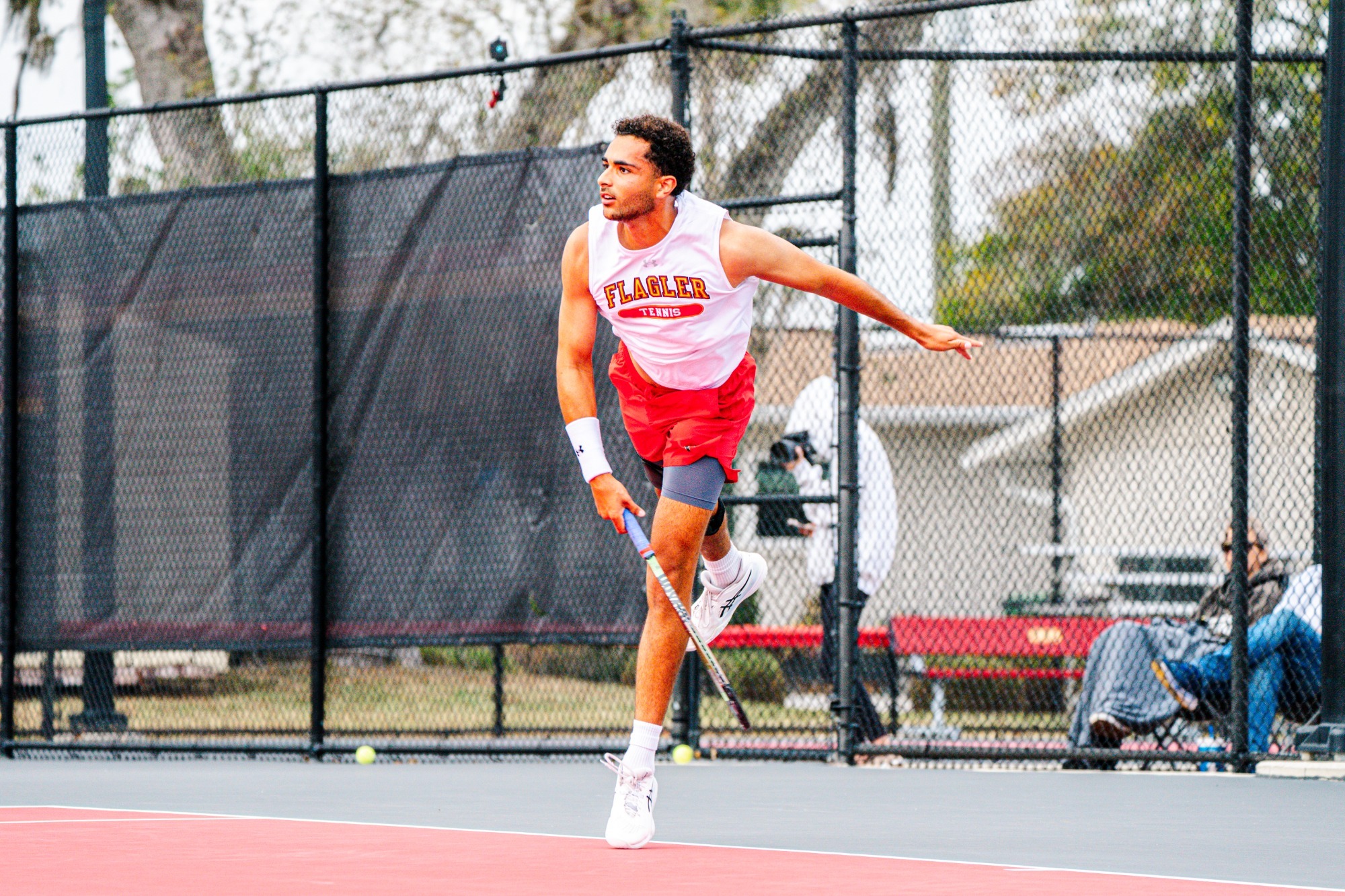 Aniss Rafiq finishing a serve