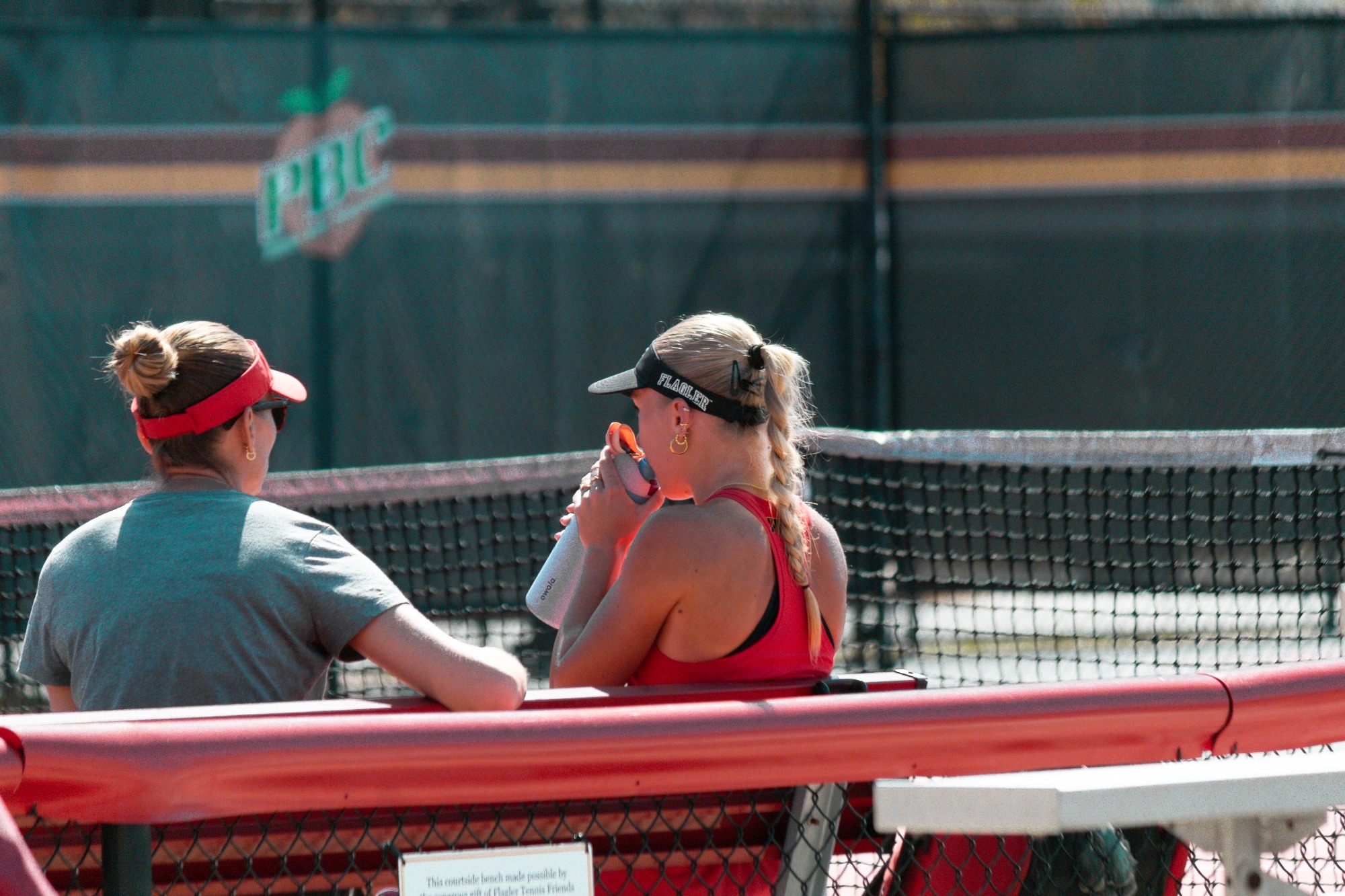 Eryka Kruk drinking water with her coach