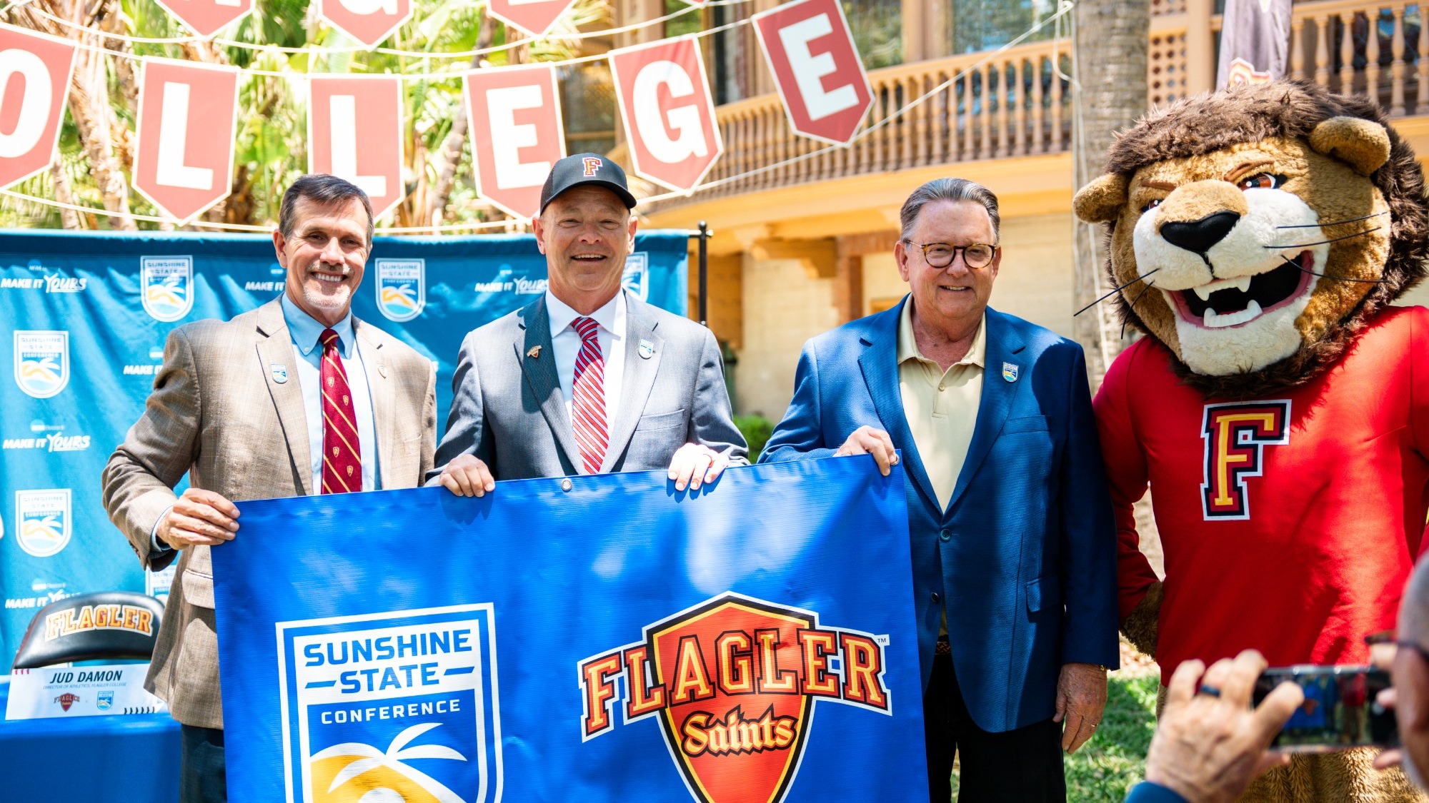 Jud Damon (left), Chris Graham (middle), and John Delaney (right) hold up acceptance document to the SSC