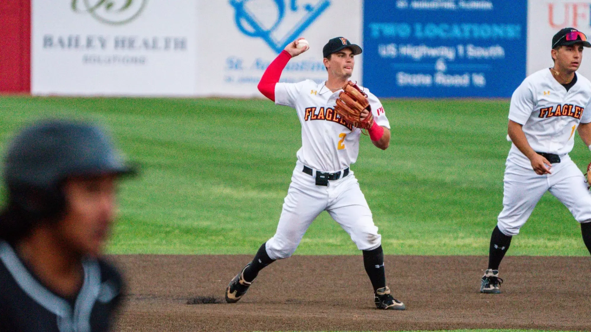 Taylor Shultz throwing to first base