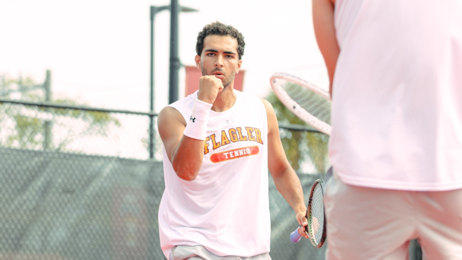 Aniss Rafiq with his fist in the air