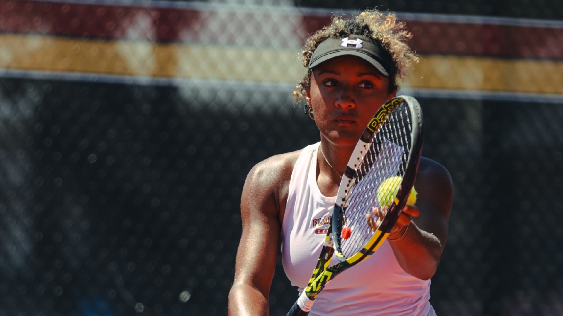 Elena Ondobo preparing to serve