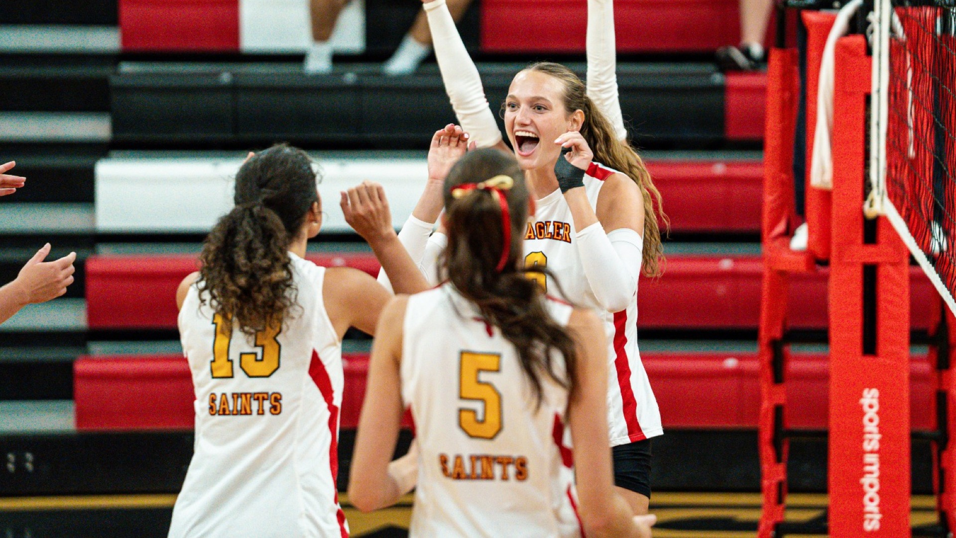 Katherine Rank cheering with Bella Law after a clean set to get the kill