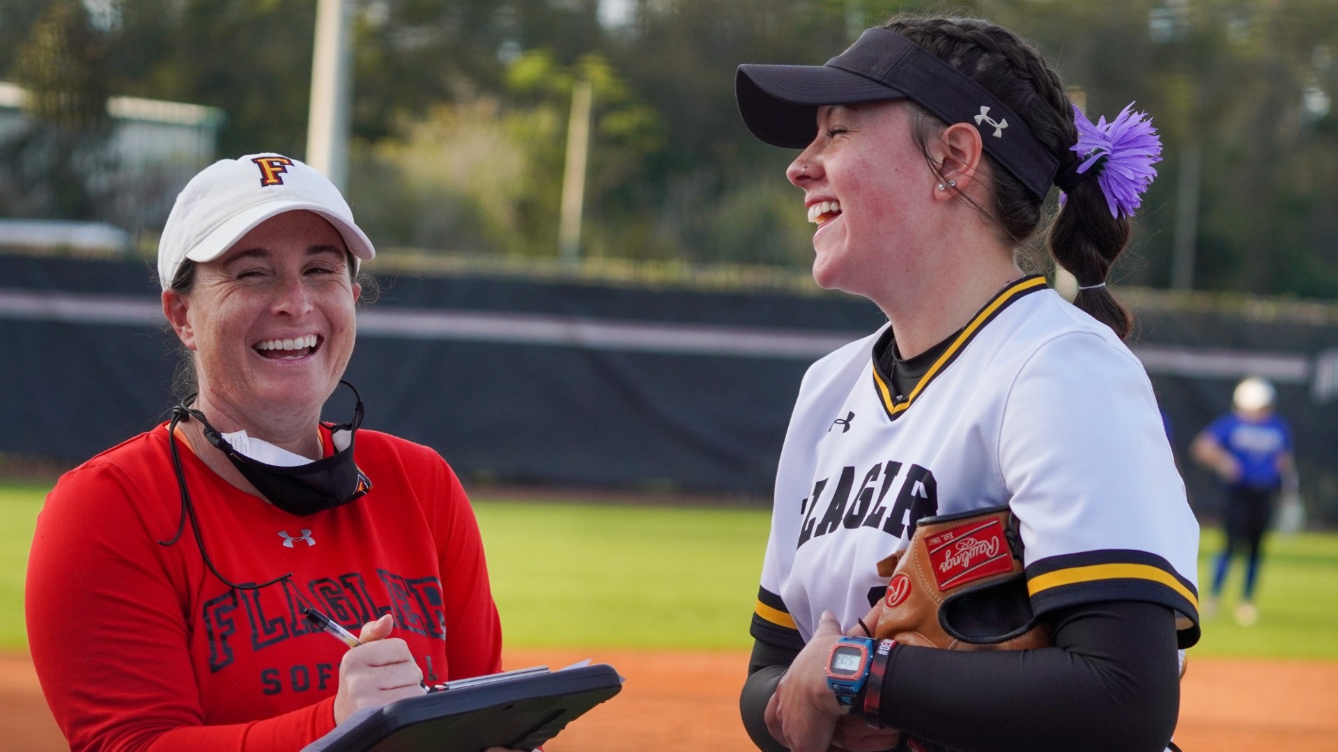 Coach Grant and Kyra Gipson laughing