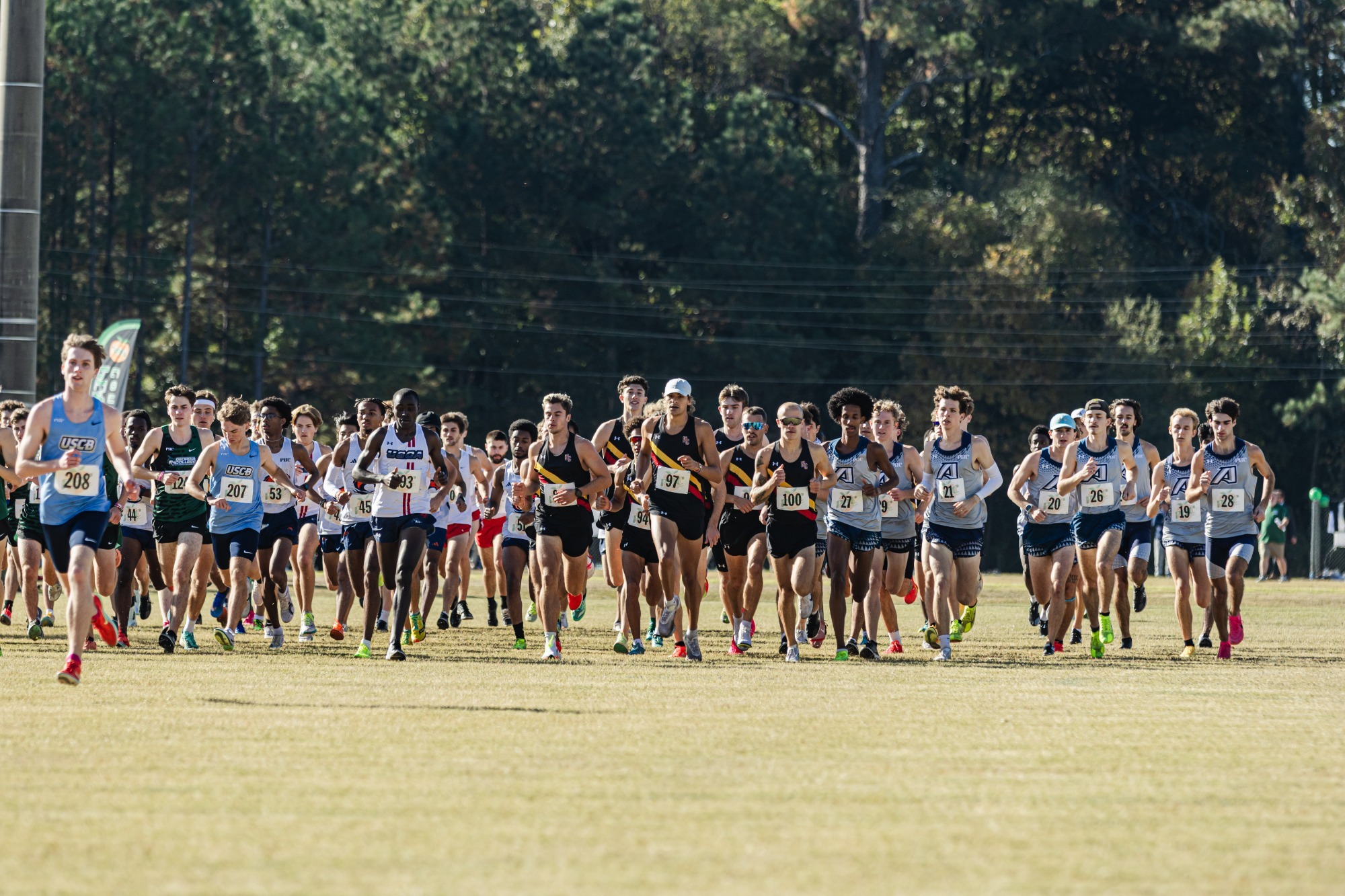 Men's team running from the gun