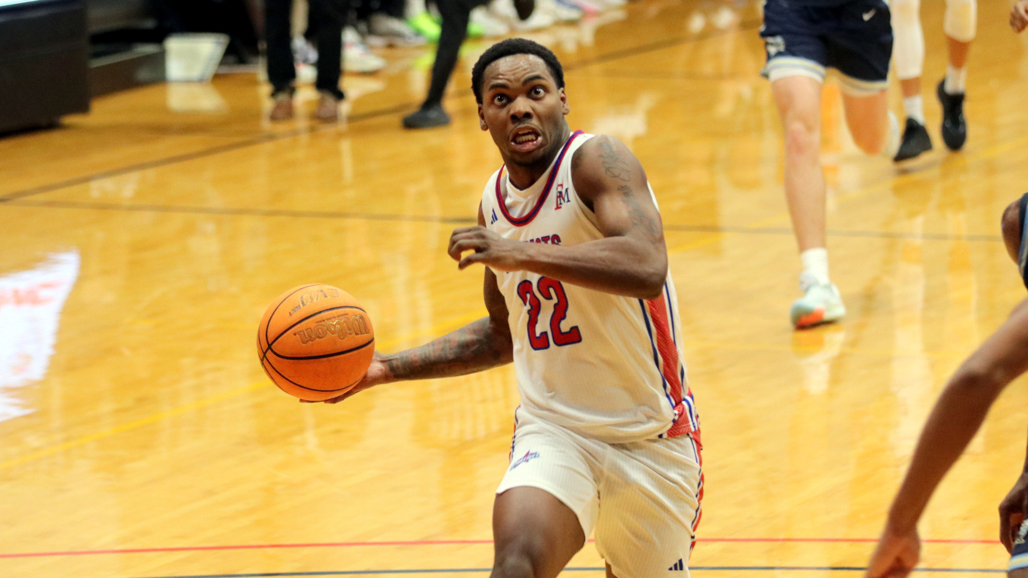 MBB26 Adonis Cole drives to the basket