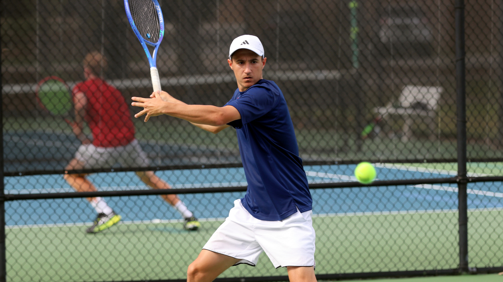 MT26 Viktor Viraghalmi looks to return a shot versus Barton College