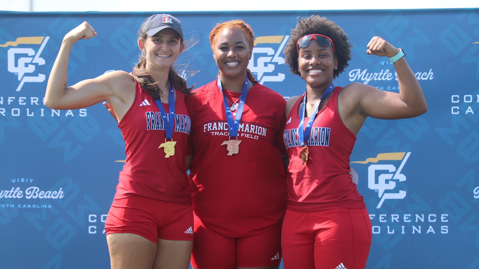 Jazmine McDonald-Craft, Catherine Green, and Rileigh Lacy celebrate on podium at Conference Carolinas Championships