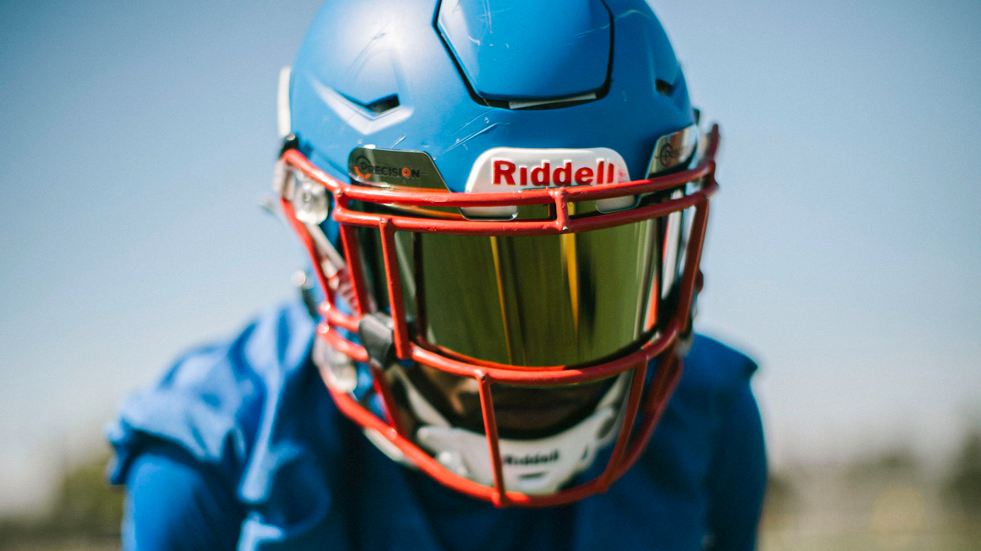 Youth Football Player Wearing Riddell Helmet