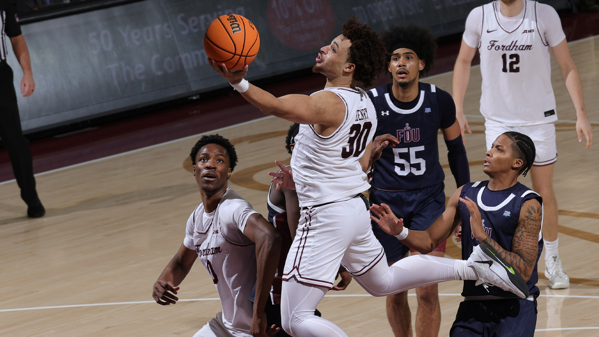 Christian Henry drives to the basket vs. FDU