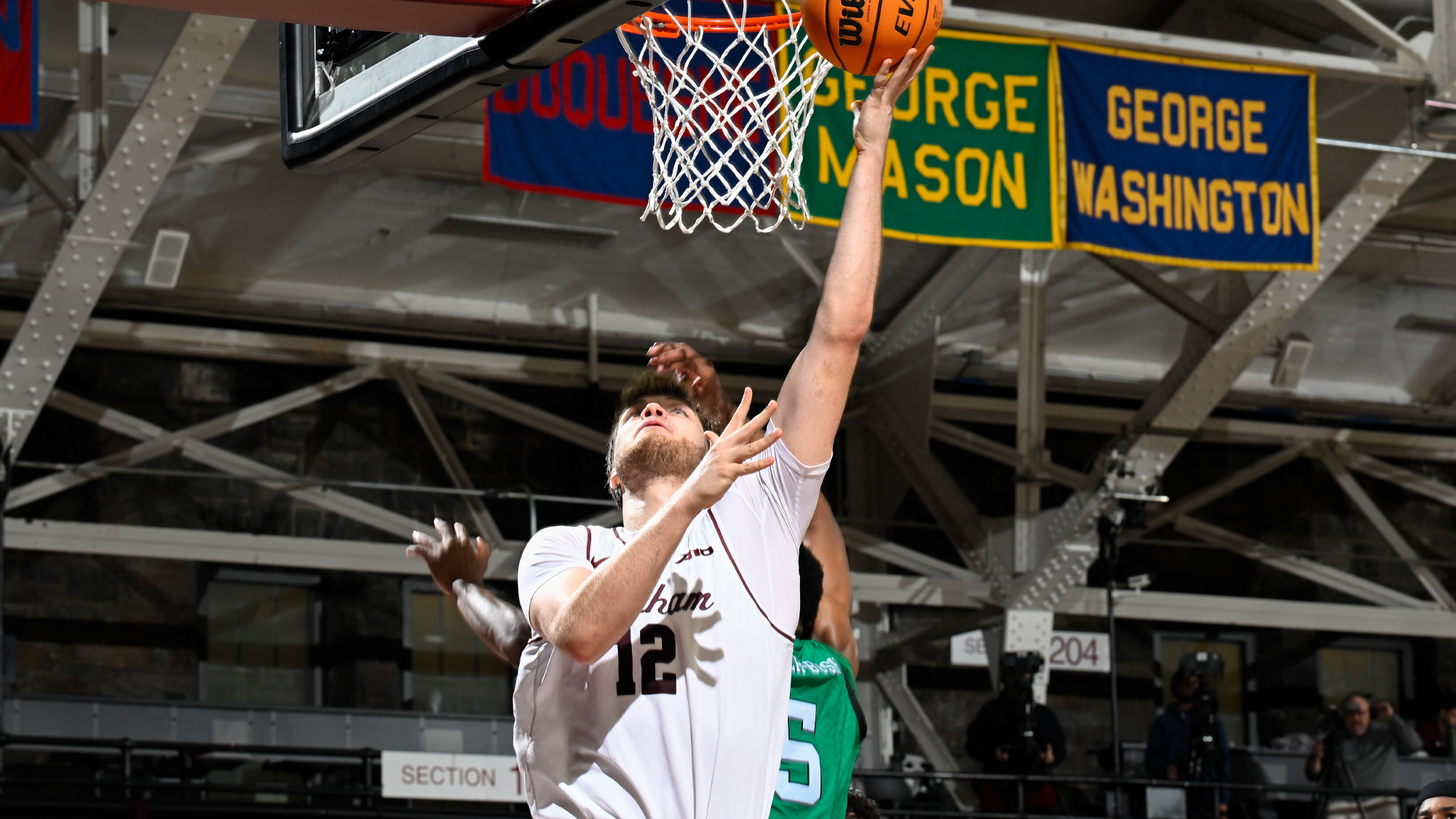 Rikus Schulte goes up for a layup vs. Manhattan