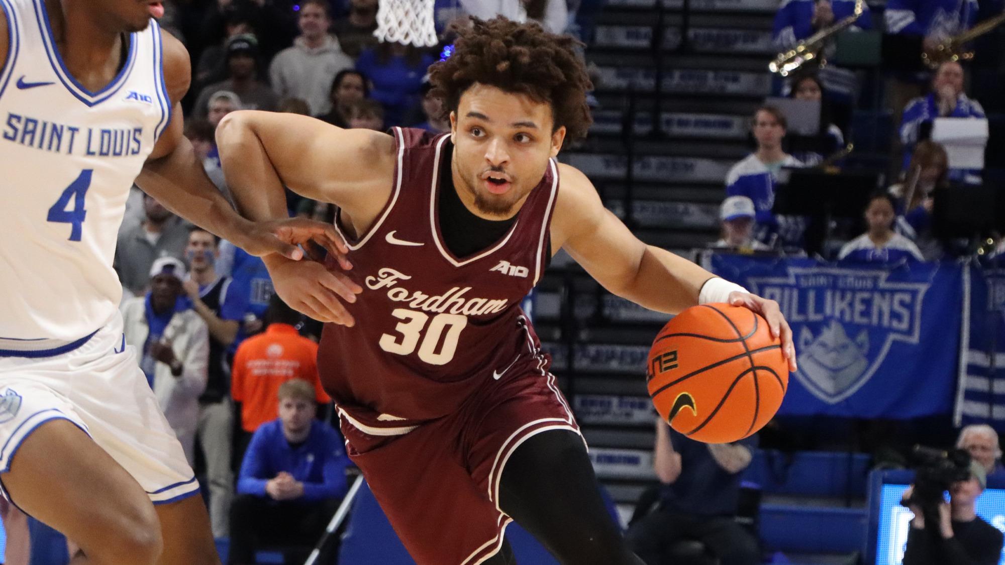 Christian Henry drives against Saint Louis
