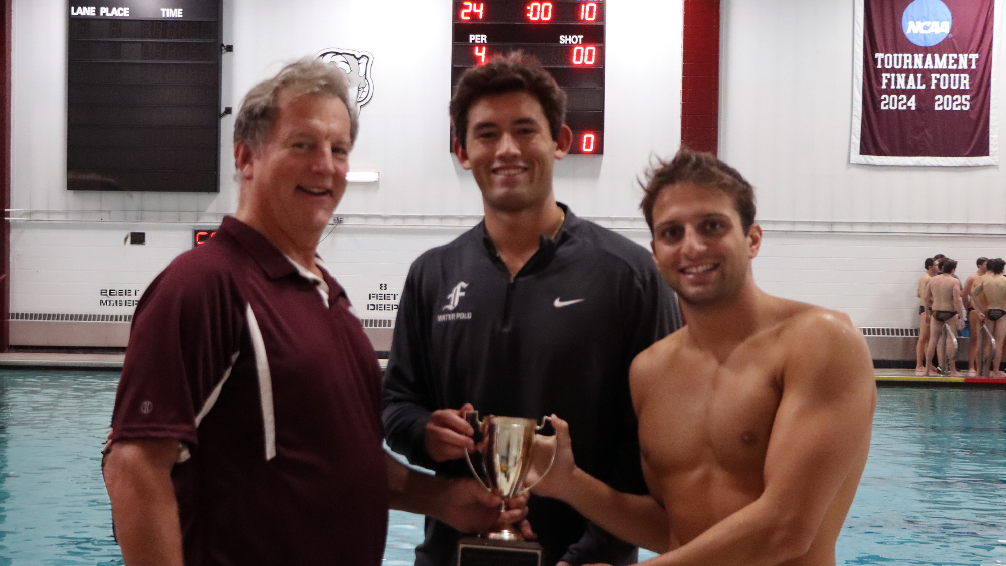 Chris Judge '80 presents te Judge Cup to the Fordham captainsChris Judge 