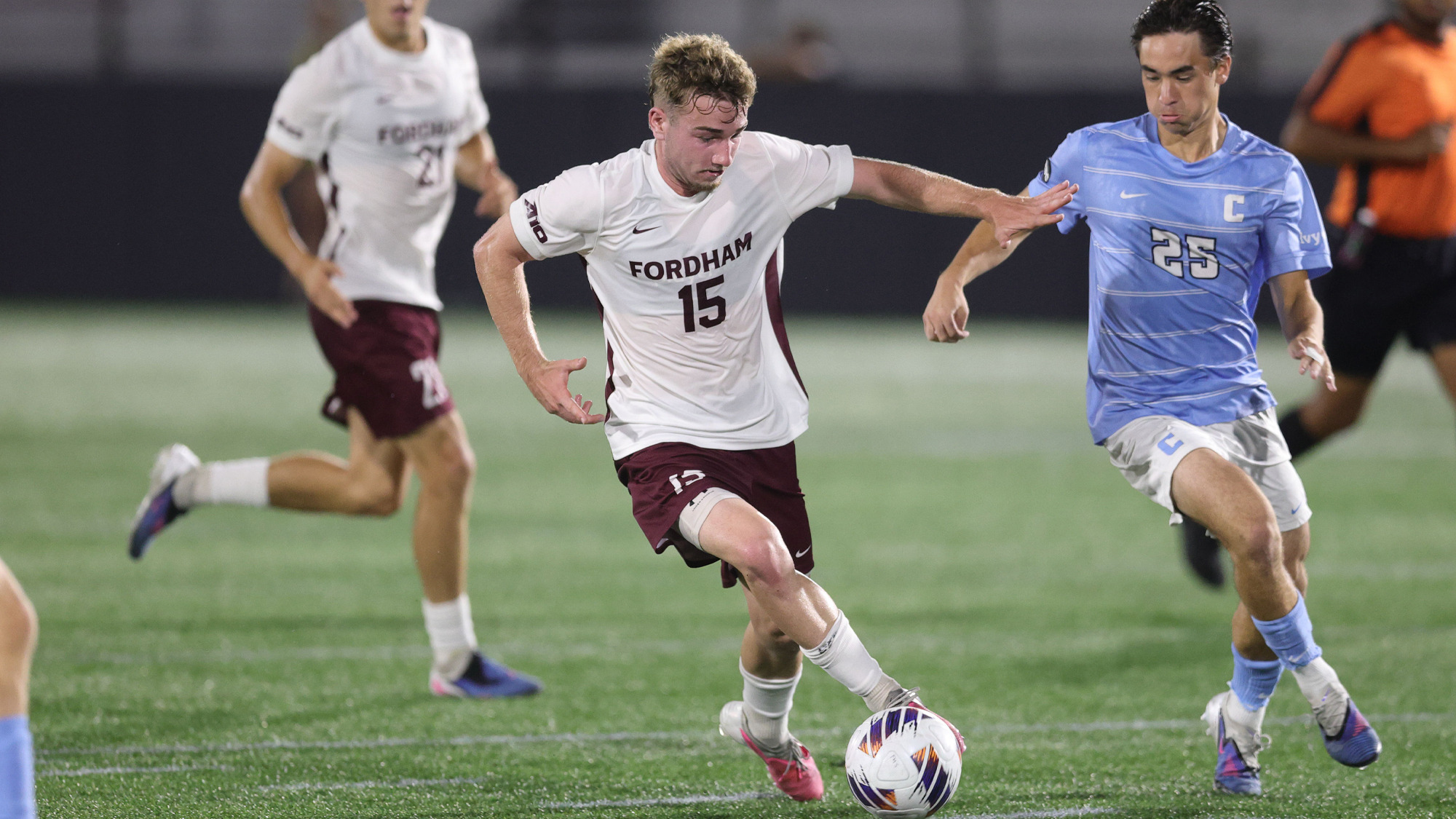 Sam Delgado dribbles through Columbia defenders
