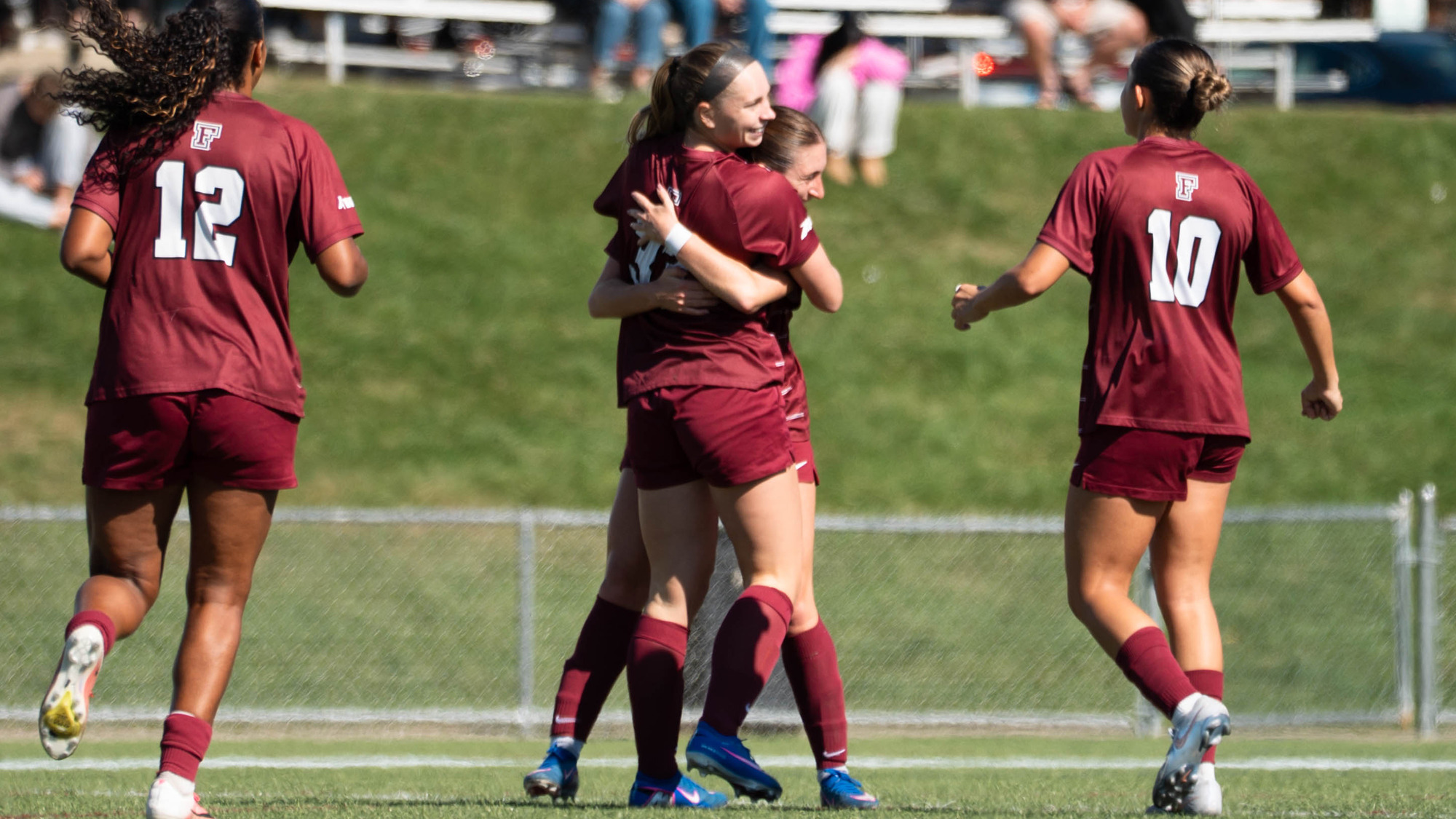 The Rams celebrate Riley Carroll's hat trick at St. Bonaventure.