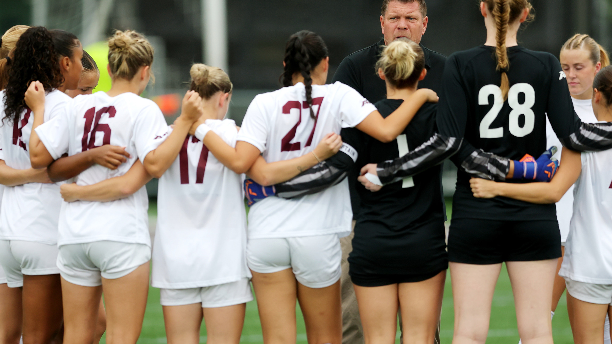 Fordham wm,en's soccer huddles before the Loyola match