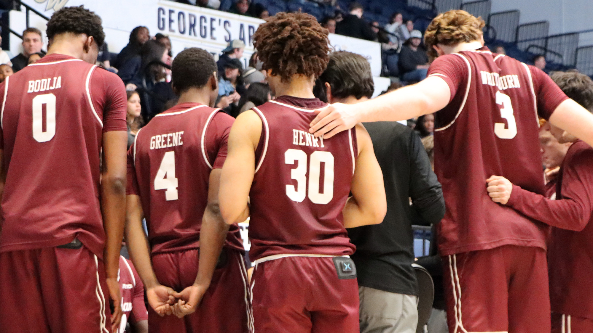 The Rams huddle at GW