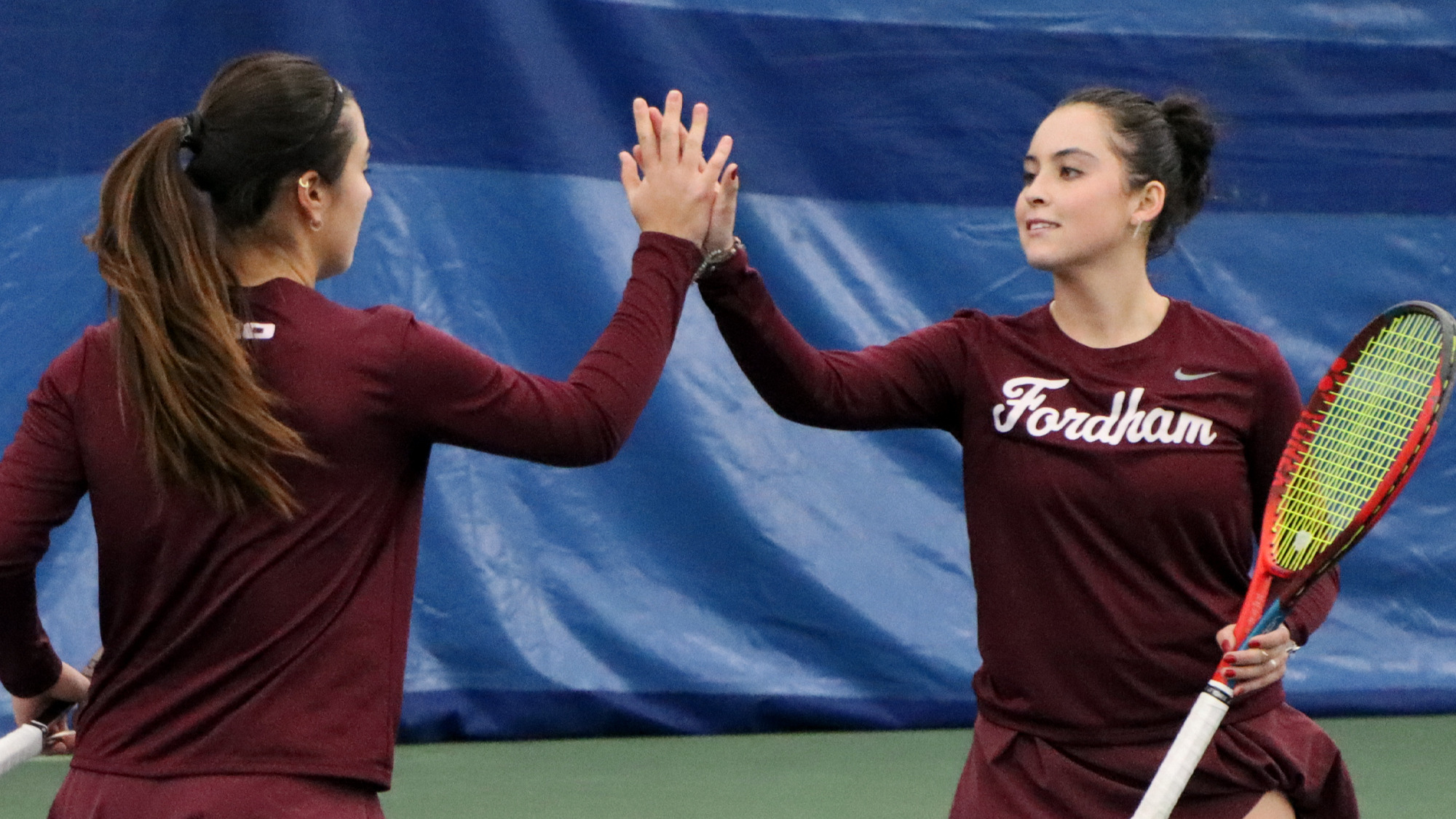 Catalina Padilla and Paola Dalmonico celebrate a doubles point 