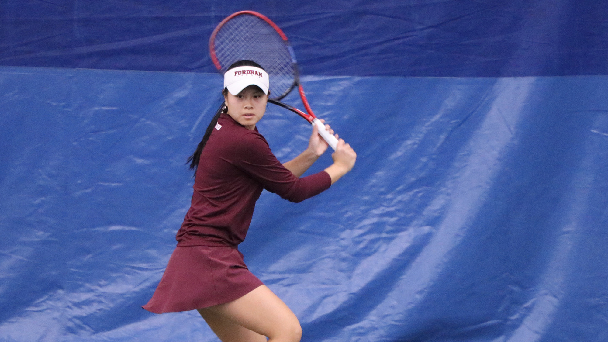 Julianne Nguyen waits to hit a backhand