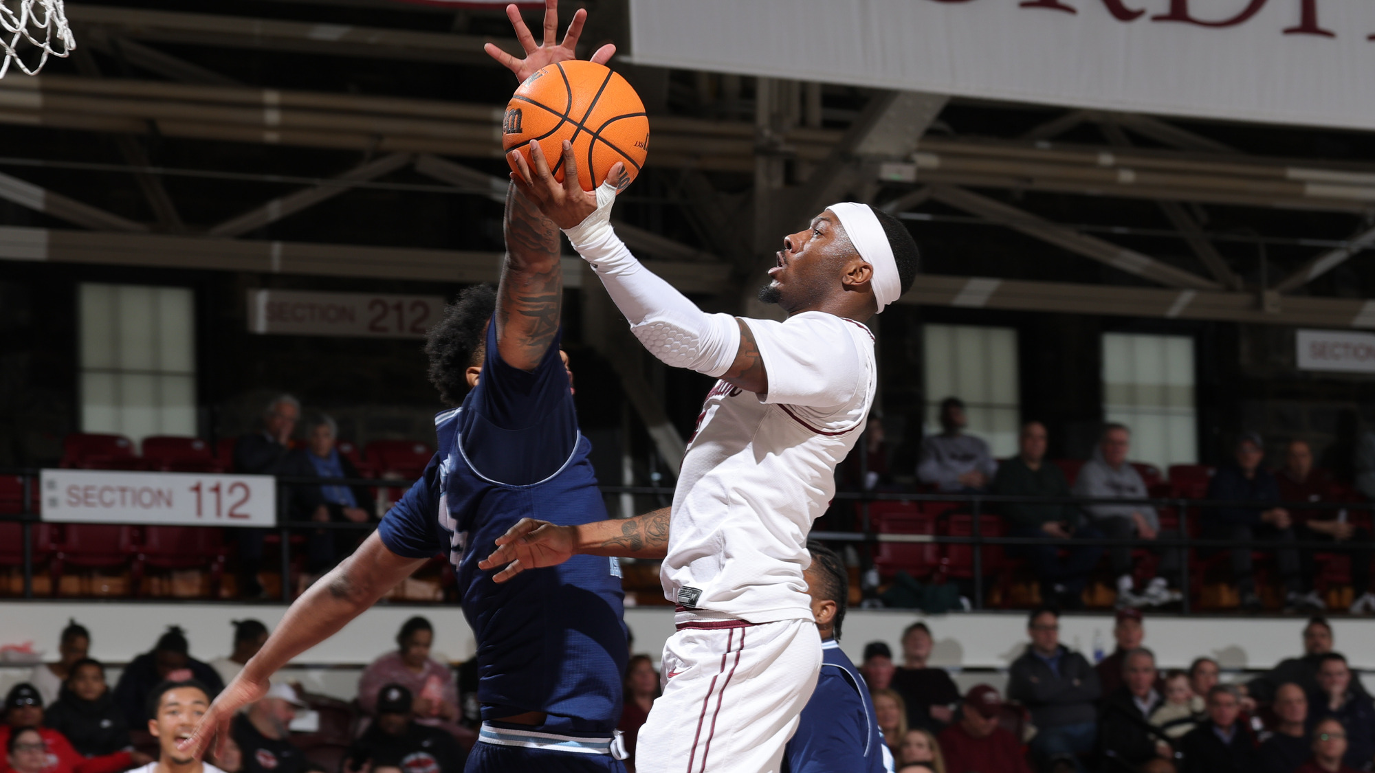 Dejour Reaves goes in for a layup vs. URI