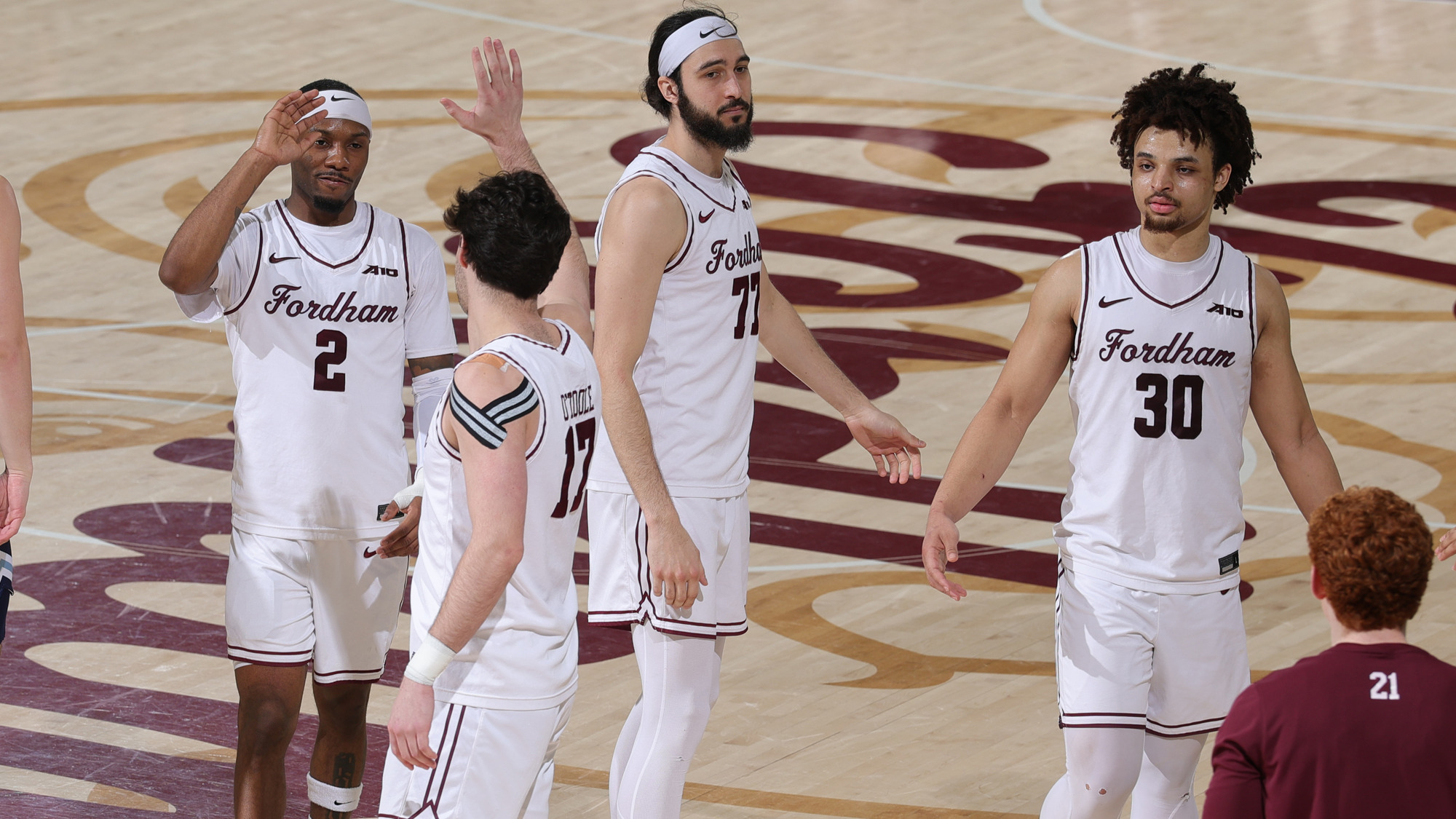 The Rams celebrate the win over Rhode Island