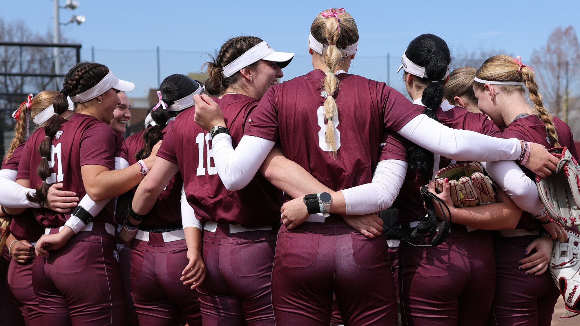 The Fordham softball squad huddles prior to the St. John's game