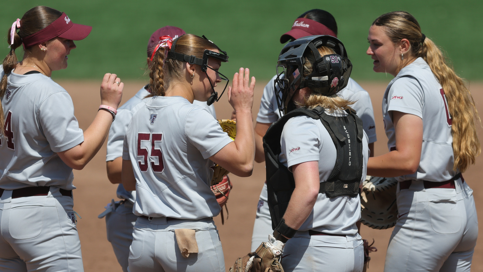 The Fordham infield meets in the pitcher's circle