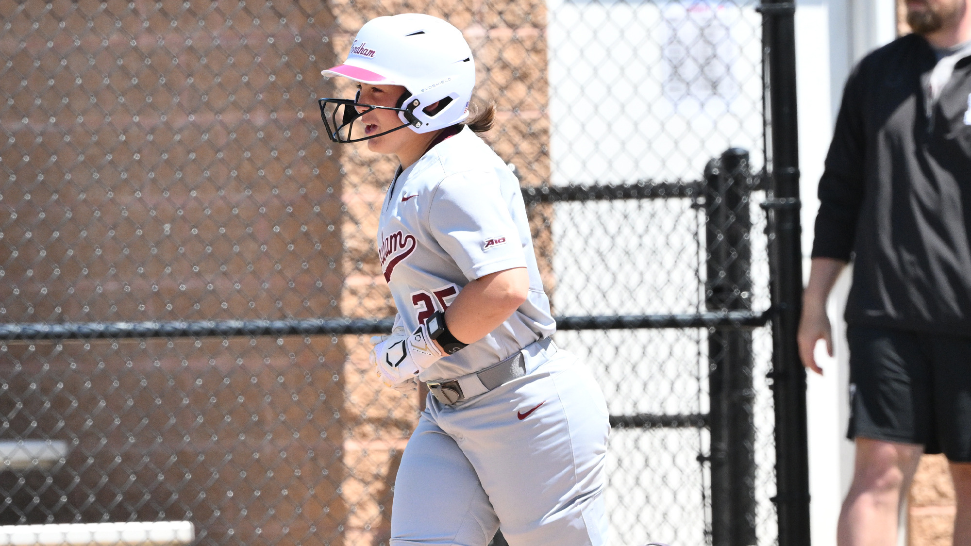 Kate McGuire heads for home after hitting a grand slam