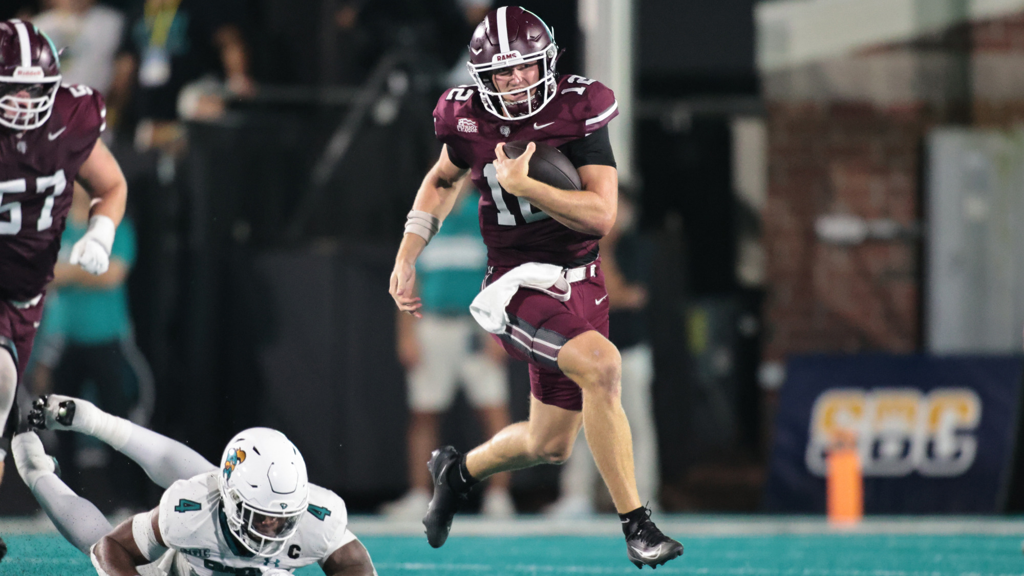 Gunnar Smith runs out of the pocket at Coastal Carolina.