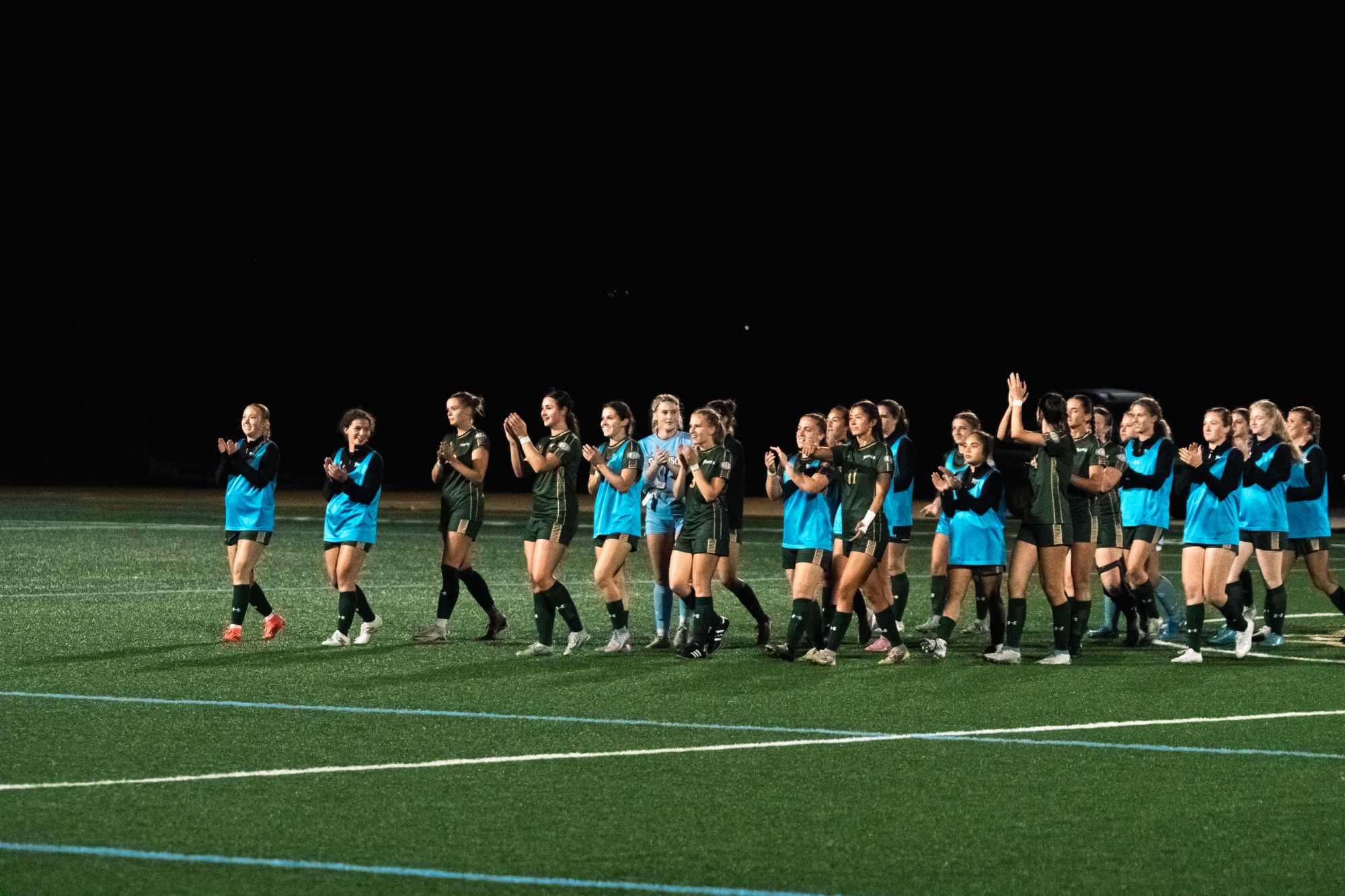 The team celebrates the win.