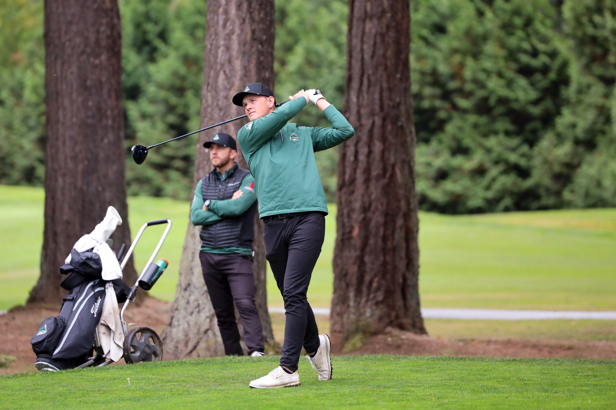 Eli Greene tees off at the WWU invitational