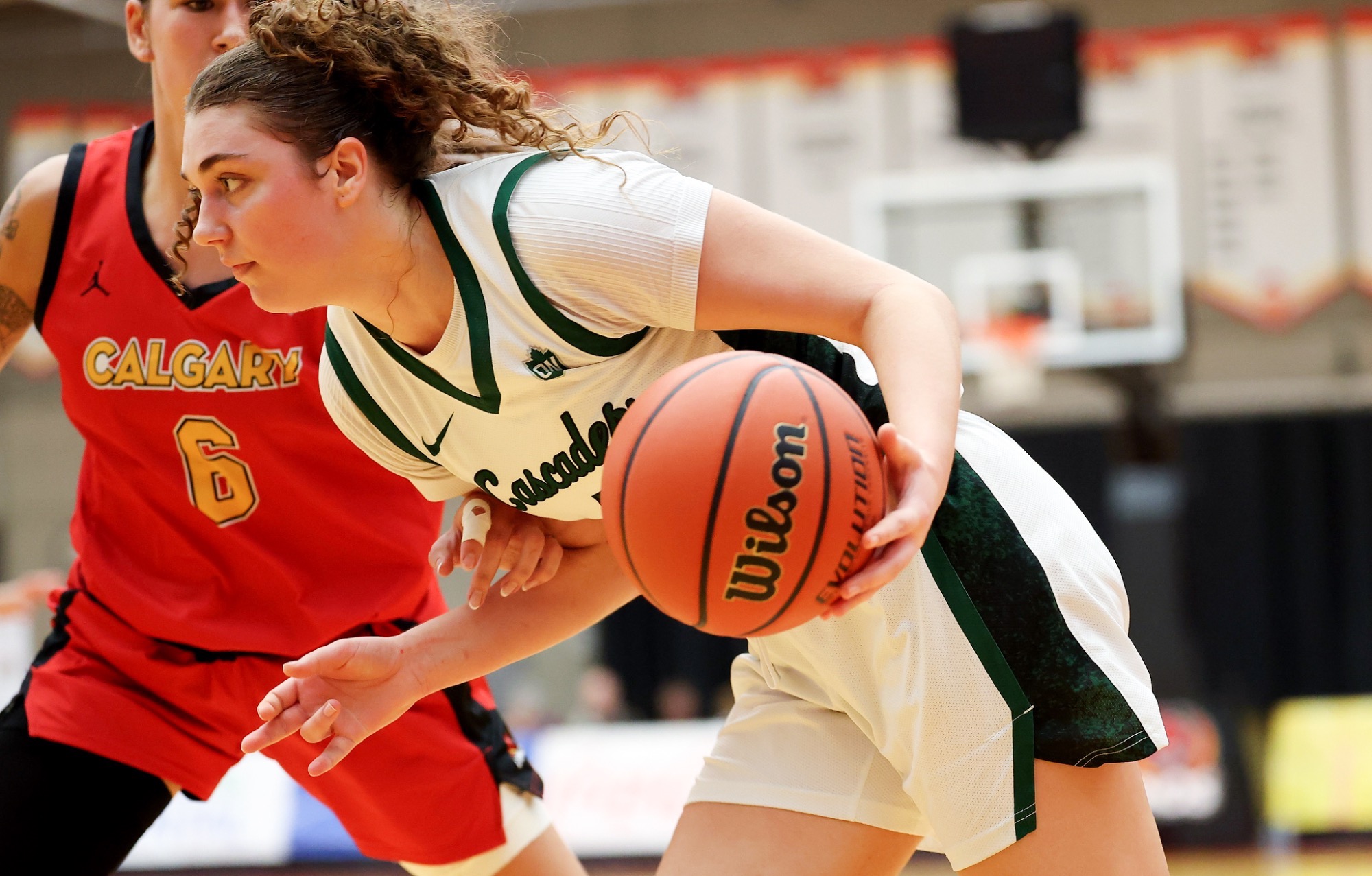 Kyanna Knodel drives with the ball against Calgary