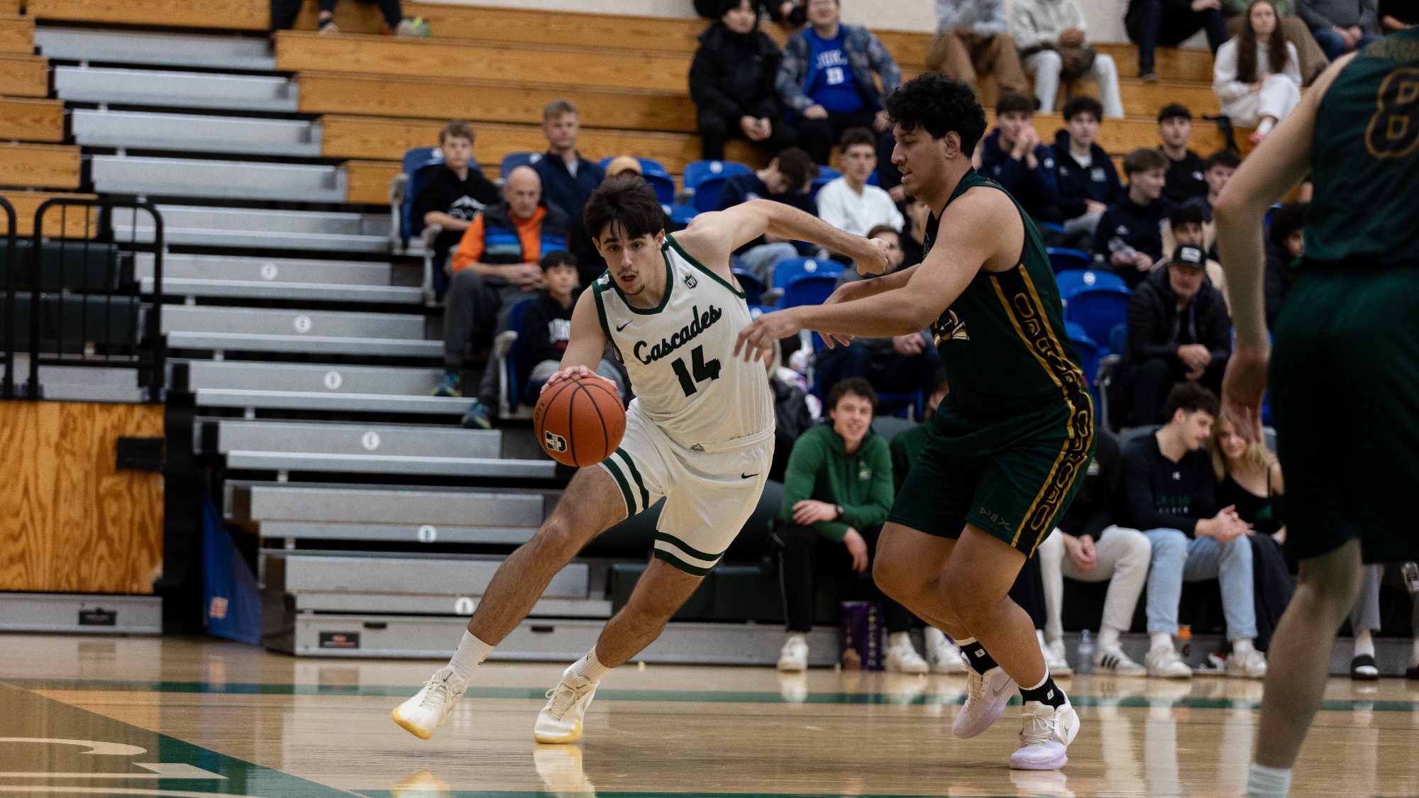 Dario Lopez drives against UNBC