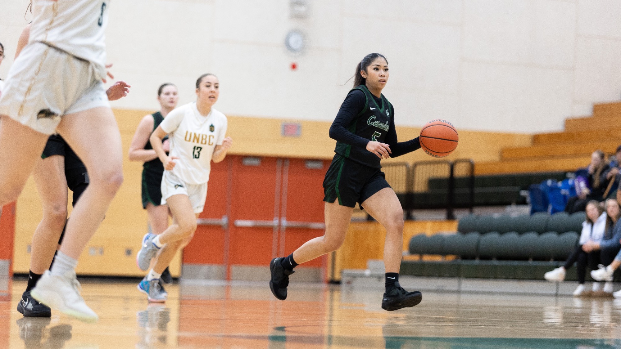 Bernie Leda goes up court with the ball