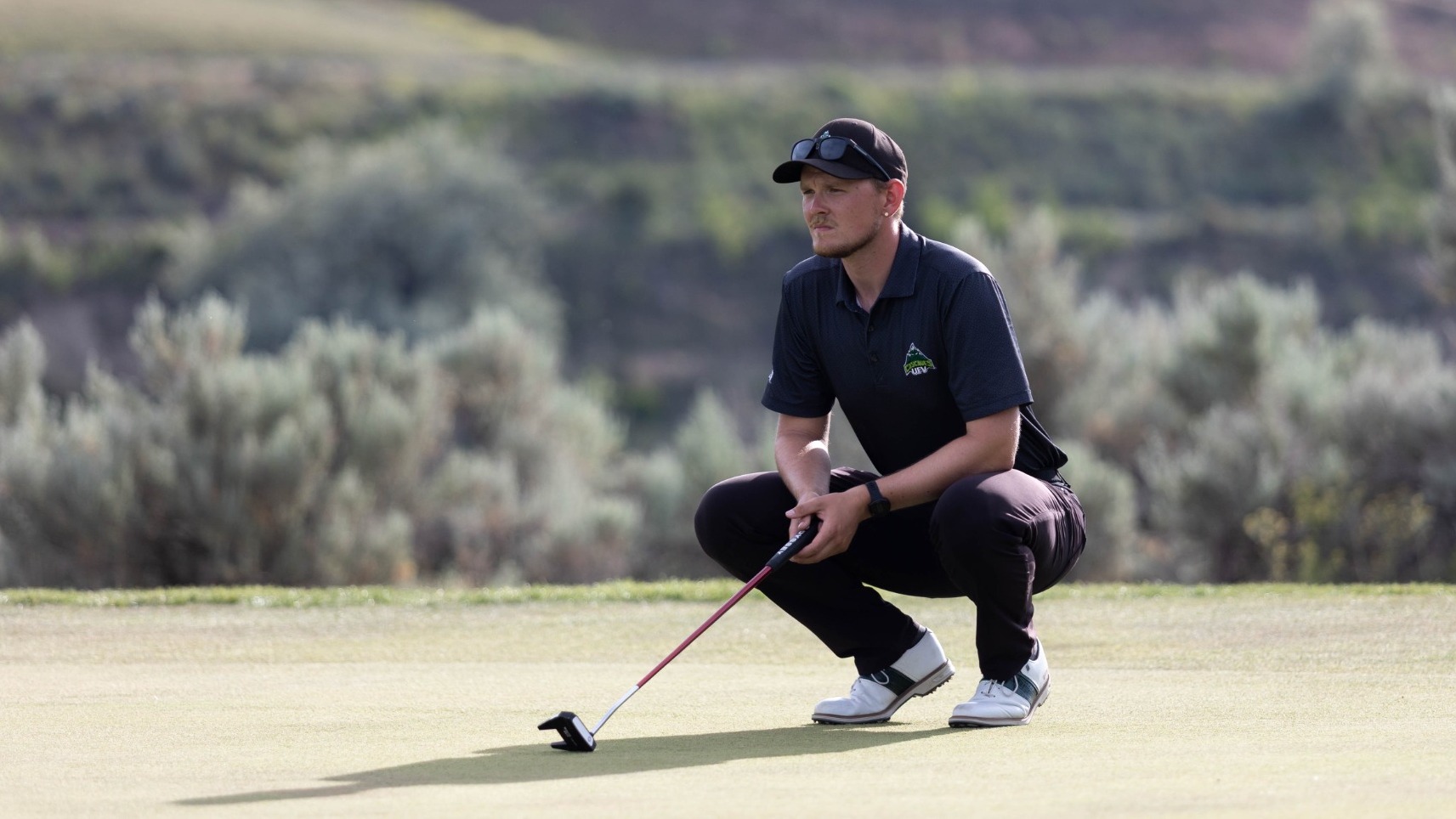 Eli Greene sets up for a putt