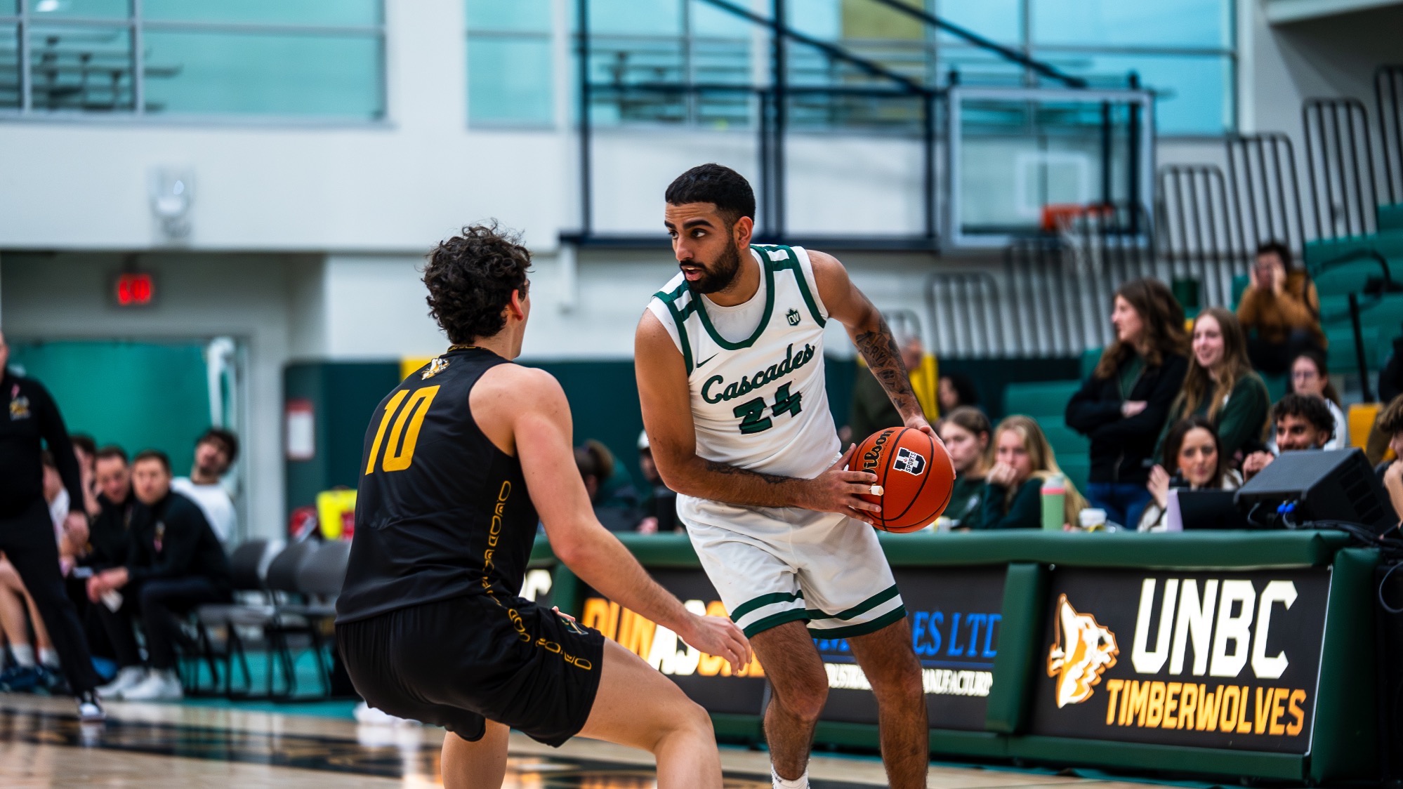 Dilveer Randhawa holds the ball against the UNBC Timberwolves
