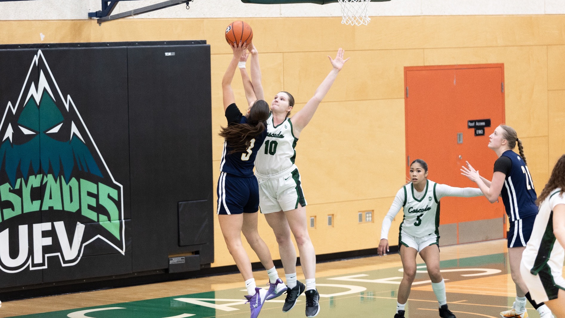 Julia Tuchscherer makes a block against UBC